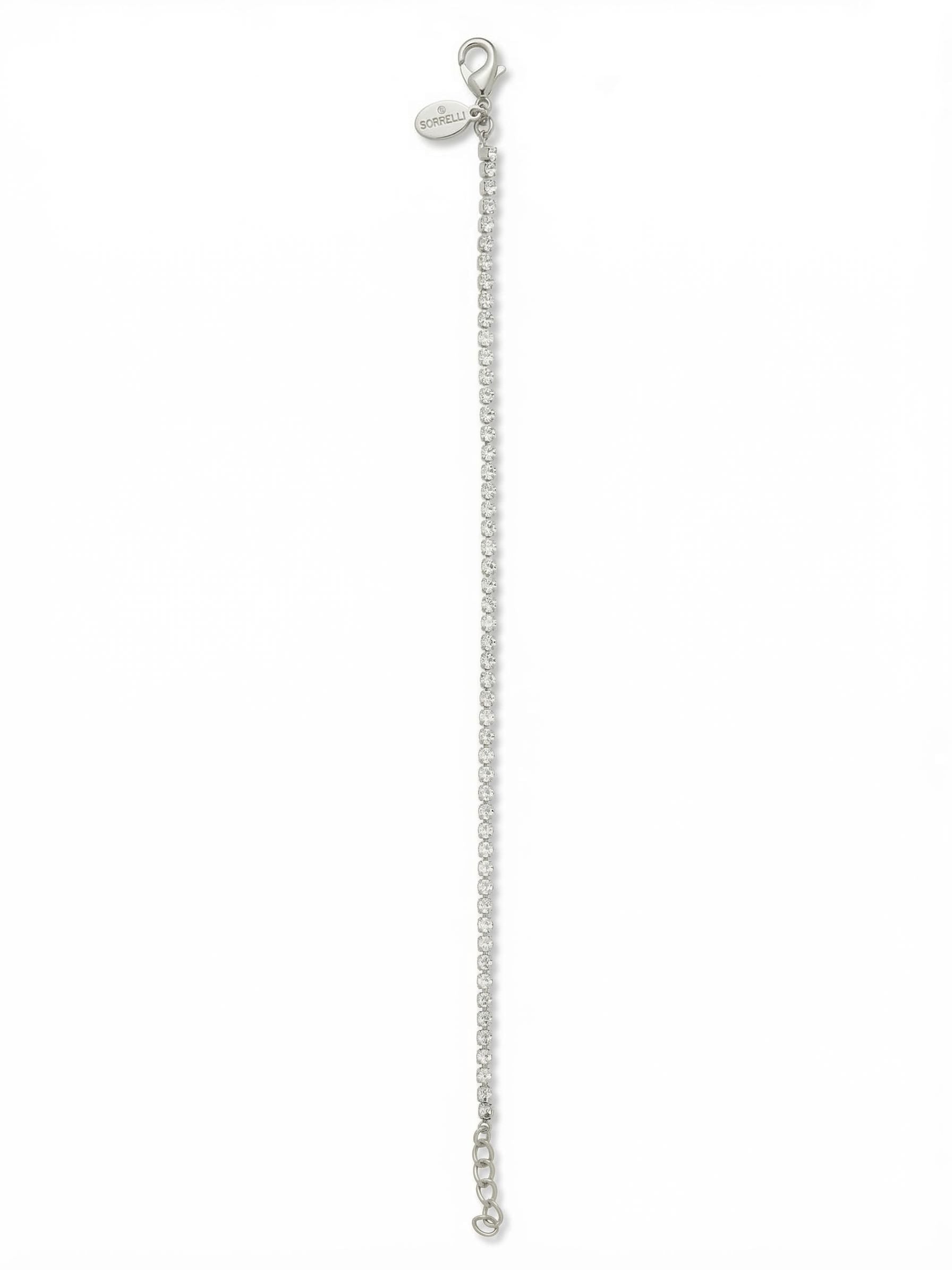 Mini Marnie Tennis Bracelet - BFS32PDCRY - <p>A whisper-thin line of continuous crystal, the Mini Marnie brings a delicate sensibility to the classic tennis bracelet. The fine rhinestone chain catches the light with every movement of your hand, offering a subtle but distinct presence. It works beautifully as a quiet standalone accent or an effortless base layer for building a custom stack. The fluid construction flexes naturally with your daily routine, and an integrated extension chain lets you tailor the drape exactly how you prefer it.</p><ul>
<li>Ultra-fine continuous crystal line</li>
<li>Fluid rhinestone chain construction for effortless stacking</li>
<li>Lobster claw clasp</li>
<li>3/4-inch adjustable extension chain</li>
<li>Protective e-coat finish for lasting wear</li>
<li>Includes signature organza pouch for gifting and travel</li>
</ul>