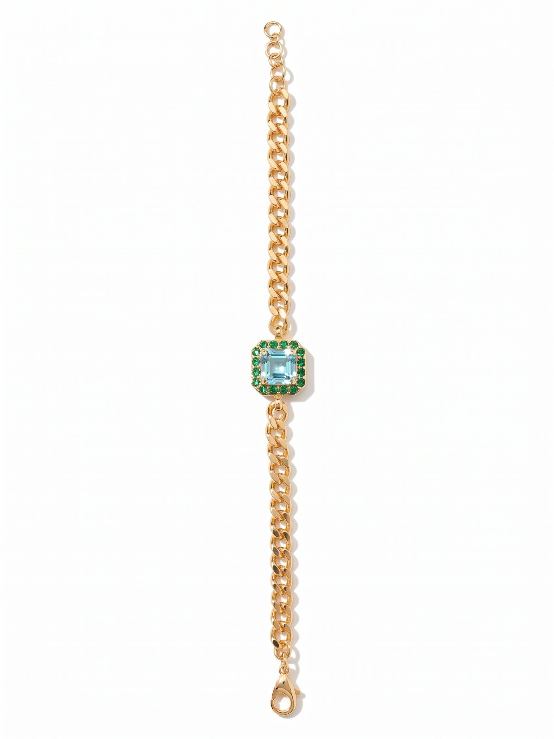 Autumn Tennis Bracelet - BFS5BGOC - <p>A solitary square-cut aquamarine crystal anchors this design, framed by a precise halo of deep green accents that catch the light with every gesture. The center station is balanced by a fluid cable chain, allowing the bracelet to drape gently and move naturally with you throughout your day. Because you can easily adjust the length to your preferred fit, this piece easily becomes a comfortable and reliable constant in your regular rotation.</p><ul>
<li>Square-cut aquamarine crystal centered on a fluid cable chain</li>
<li>Contrast halo of deep green crystals framing the center stone</li>
<li>Lobster claw clasp</li>
<li>3/4-inch adjustable extension chain</li>
<li>Protective e-coat finish for lasting wear</li>
<li>Includes signature organza pouch for gifting and travel</li>
</ul>