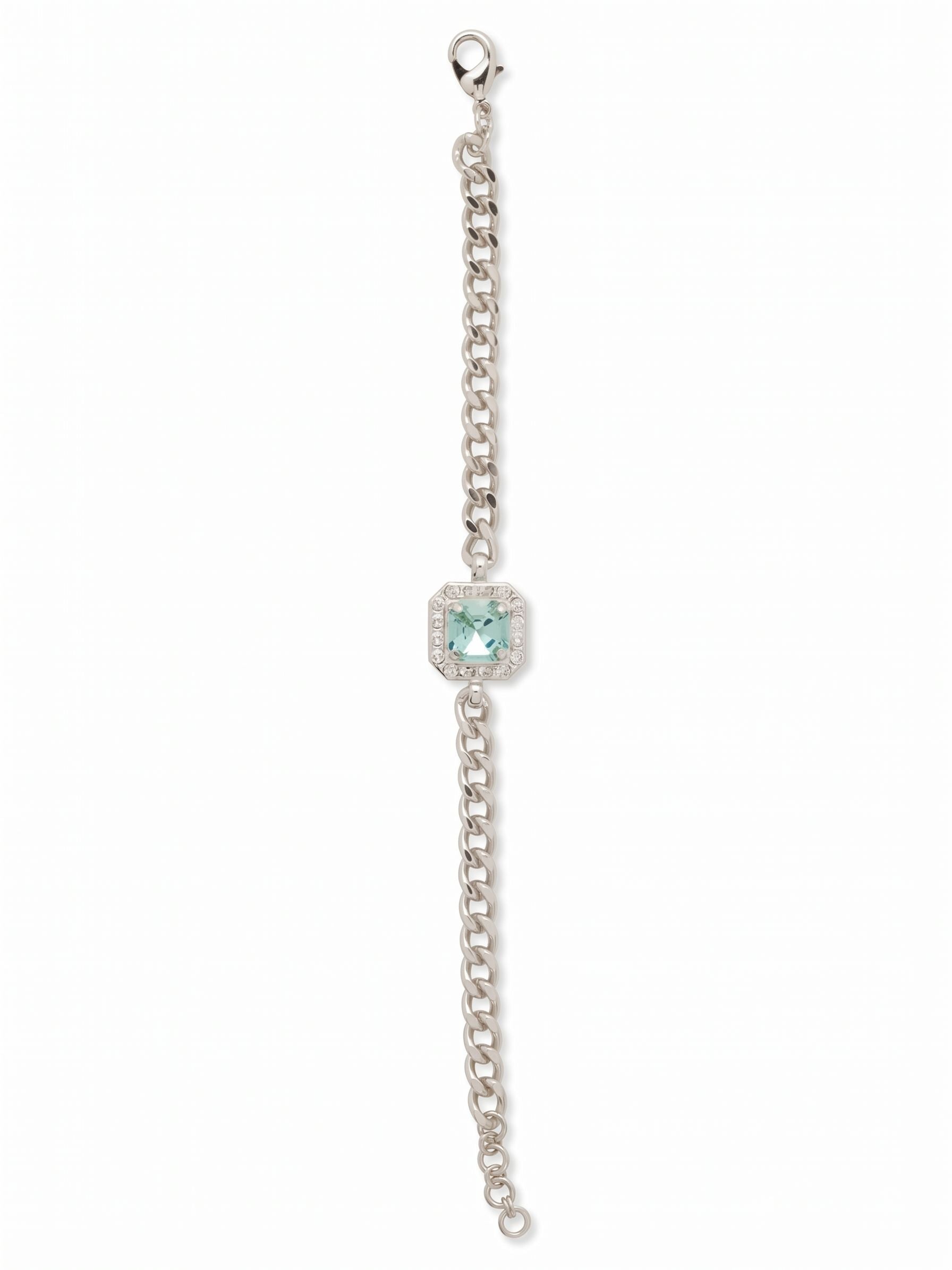 Autumn Tennis Bracelet - BFS5PDAQU - <p>A single square-cut aquamarine crystal anchors this fluid cable chain, framed by delicate accent stones that catch the light with every gesture. The contrast between the geometric center and the draped metallic links gives the piece a grounded, wearable ease. An adjustable extension chain allows you to tailor the drape so it glides naturally over your hand. It brings a crisp accent to your daily rotation, stepping in easily as a solo signature or layered into a heavier stack.</p><ul>
<li>Single focal square-cut crystal framed by a delicate accent border</li>
<li>Fluid cable chain construction that allows natural movement</li>
<li>Lobster claw clasp</li>
<li>3/4-inch adjustable extension chain</li>
<li>Protective e-coat finish for lasting wear</li>
<li>Includes signature organza pouch for gifting and travel</li>
</ul>