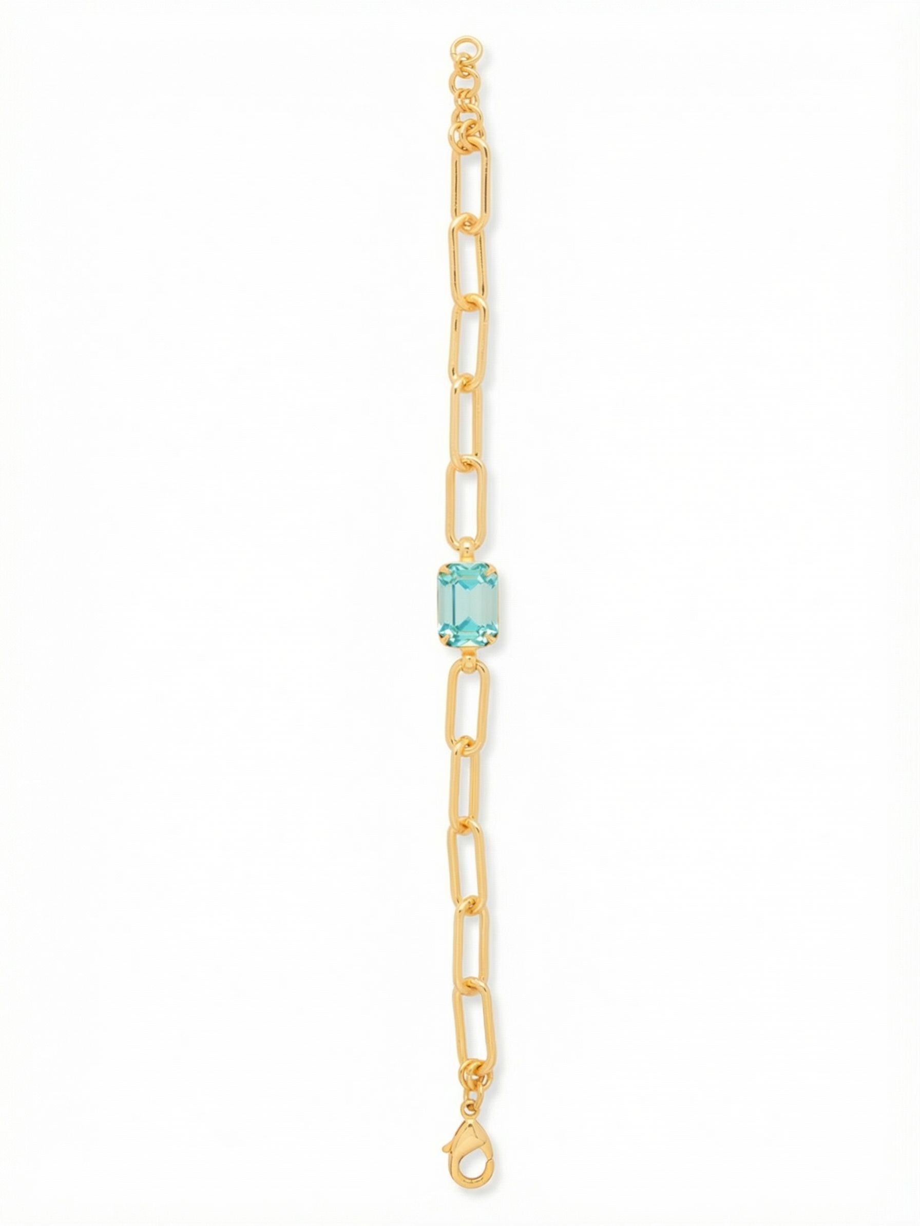 Nia Tennis Bracelet - BFS77BGAQU - <p>A single emerald-cut aquamarine crystal anchors this airy design. The elongated links of the paperclip chain move fluidly as you type and reach, offering a subtle gleam that balances the clean lines of the center stone. With the adjustable extension chain, you can secure it snugly to keep the focal point centered on your wrist, or let it drape loosely for a relaxed feel alongside your daily watch.</p><ul>
<li>Single emerald-cut crystal provides a clear focal point</li>
<li>Elongated paperclip links create an open fluid drape</li>
<li>Lobster claw clasp</li>
<li>3/4-inch adjustable extension chain</li>
<li>Protective e-coat finish for lasting wear</li>
<li>Includes signature organza pouch for gifting and travel</li>
</ul>