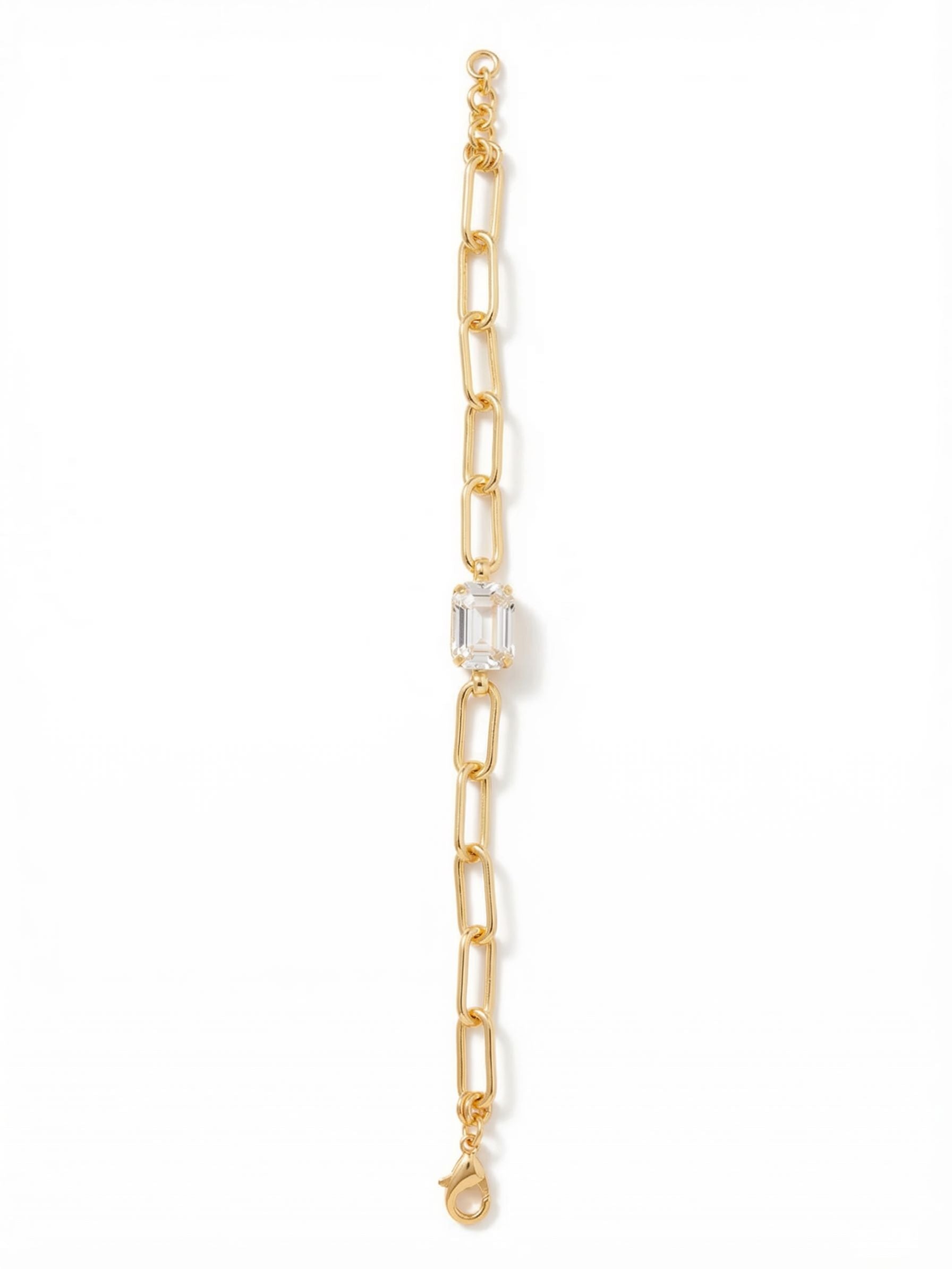 Nia Tennis Bracelet - BFS77BGCRY - <p>The bold geometry of a single emerald-cut crystal grounds this modern chain bracelet. Substantial paperclip links provide an airy contrast to the structured center stone, creating a piece that moves effortlessly as you go about your day. An extension chain allows you to tailor the fit for comfortable wear. It works quietly on its own but holds its ground perfectly when layered with your other favorite chains.</p><ul>
<li>Large emerald-cut center stone anchored by elongated paperclip links</li>
<li>Bold geometric contrast between the faceted crystal and smooth metal</li>
<li>Lobster claw clasp</li>
<li>3/4-inch adjustable extension chain</li>
<li>Protective e-coat finish for lasting wear</li>
<li>Includes signature organza pouch for gifting and travel</li>
</ul>