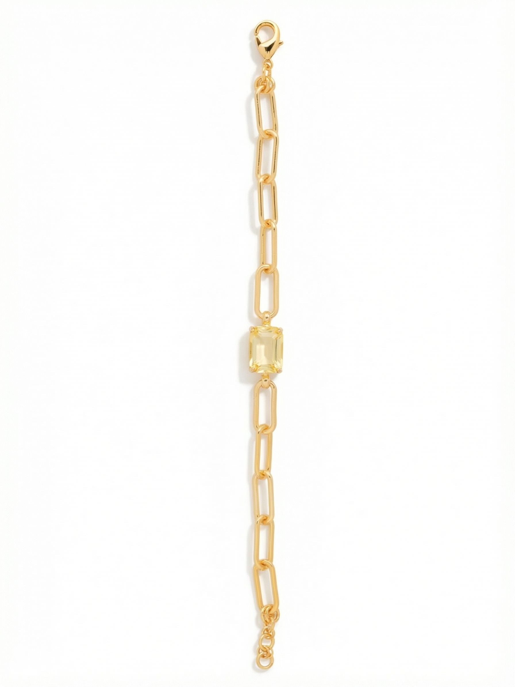 Nia Tennis Bracelet - BFS77BGLTD - <p>The open links of the paperclip chain give this bracelet a relaxed everyday ease that pairs effortlessly with your favorite watch or solid cuffs. At the center, a solitary emerald-cut crystal acts as an anchor point, catching ambient light with the natural movement of your hand. The bright gold tone warms up the pale topaz stone, creating a quiet glow. An adjustable closure lets you control the drape, keeping the central stone balanced and secure.</p><ul>
<li>Solitary emerald-cut focal crystal</li>
<li>Open paperclip chain links for fluid movement</li>
<li>Lobster claw clasp</li>
<li>3/4-inch adjustable extension chain</li>
<li>Protective e-coat finish for lasting wear</li>
<li>Includes signature organza pouch for gifting and travel</li>
</ul>