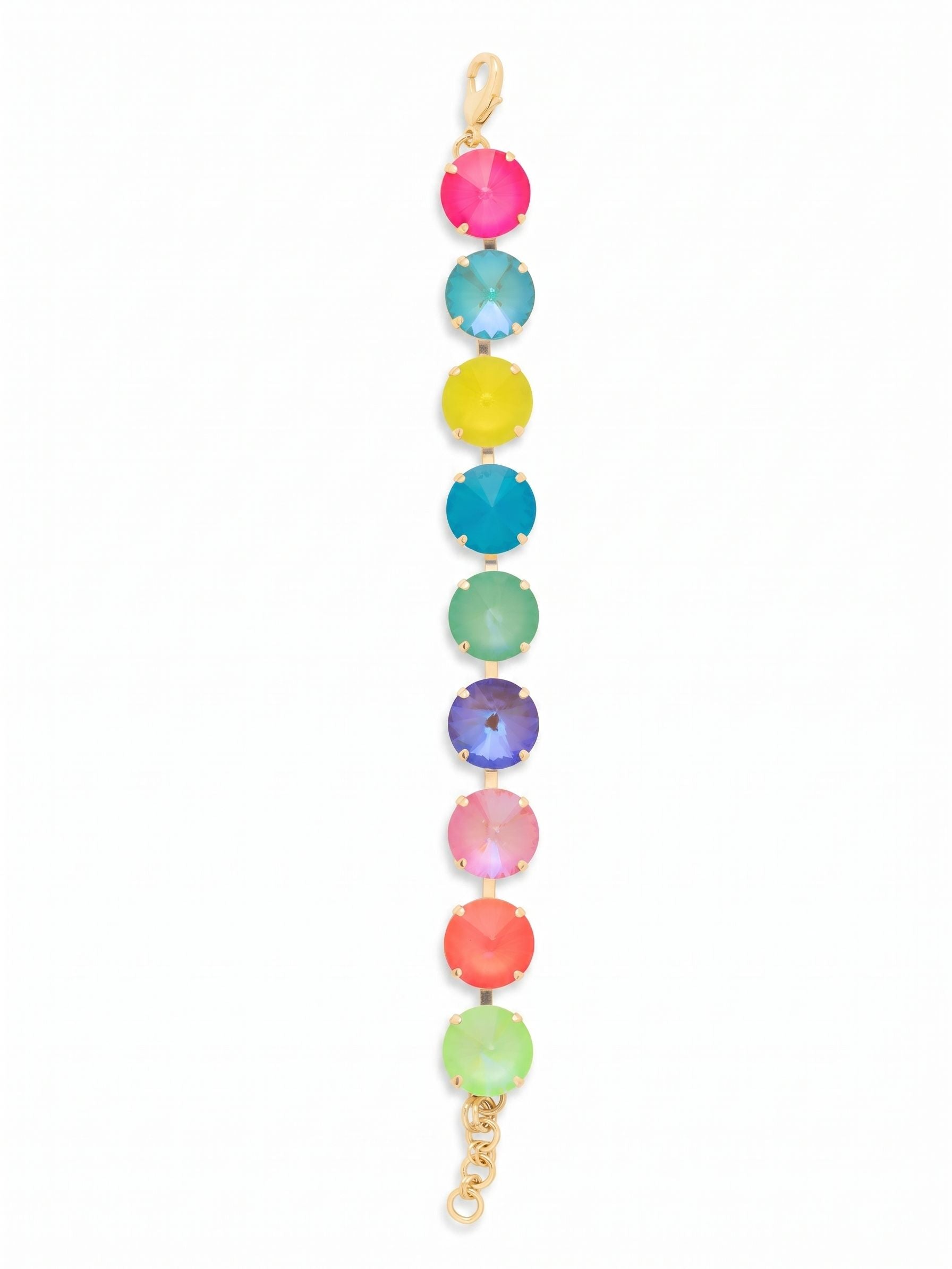 Nadine Tennis Bracelet - BFU3BGCCA - <p>A saturated spectrum of color defines this vibrant tennis bracelet. Nine oversized crystals alternate in a bright rhythm of electric pinks, minted greens, and cool blues, all framed in a warm gold-tone setting. The articulated kette chain construction allows each substantial stone to move independently, giving the piece a fluid drape that follows the natural motion of your arm. An included extension chain lets you easily adjust the sizing to find your preferred fit.</p><ul>
<li>Nine distinctly colored crystals create a bright, varied spectrum</li>
<li>Fluid channel chain construction allows the oversized stones to move freely</li>
<li>Lobster claw clasp</li>
<li>3/4-inch adjustable extension chain</li>
<li>Protective e-coat finish for lasting wear</li>
<li>Includes signature organza pouch for gifting and travel</li>
</ul>