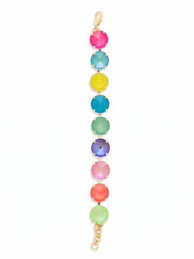 Nadine Tennis Bracelet - BFU3BGCCA - <p>A saturated spectrum of color defines this vibrant tennis bracelet. Nine oversized crystals alternate in a bright rhythm of electric pinks, minted greens, and cool blues, all framed in a warm gold-tone setting. The articulated kette chain construction allows each substantial stone to move independently, giving the piece a fluid drape that follows the natural motion of your arm. An included extension chain lets you easily adjust the sizing to find your preferred fit.</p><ul>
<li>Nine distinctly colored crystals create a bright, varied spectrum</li>
<li>Fluid channel chain construction allows the oversized stones to move freely</li>
<li>Lobster claw clasp</li>
<li>3/4-inch adjustable extension chain</li>
<li>Protective e-coat finish for lasting wear</li>
<li>Includes signature organza pouch for gifting and travel</li>
</ul>