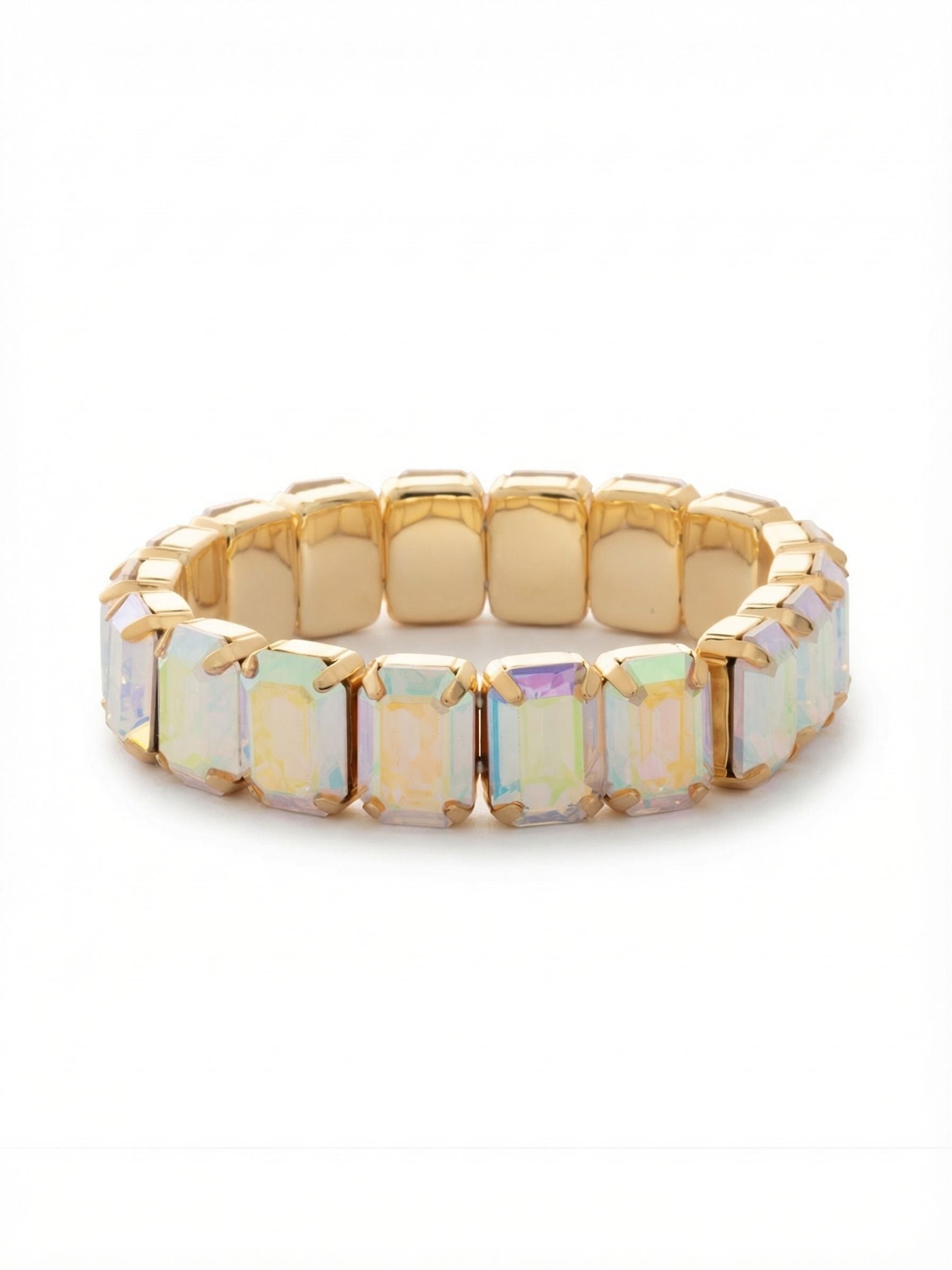 Everyday Emerald Stretch Bracelet - BFY3BGCAB - <p>An unbroken line of iridescent color with substantial presence. Large emerald-cut crystals form a continuous band, catching the light with broad flashes of pastel hues rather than tiny flickers. The warm metal settings add a structured, geometric frame to each stone. Built on a flexible base, the design slips on easily without the need to navigate a clasp. It offers a comfortable, adaptive fit that flexes as you type, reach, and move. The generous scale makes a quiet impact alone while anchoring a stack of thinner chains.</p><ul>
<li>Continuous band of large emerald-cut crystals for uninterrupted color</li>
<li>Step-cut faceting creates broad flashes of iridescent pastel light</li>
<li>Stretch easy slip-on design</li>
<li>Protective e-coat finish for lasting wear</li>
<li>Includes signature organza pouch for gifting and travel</li>
</ul>
