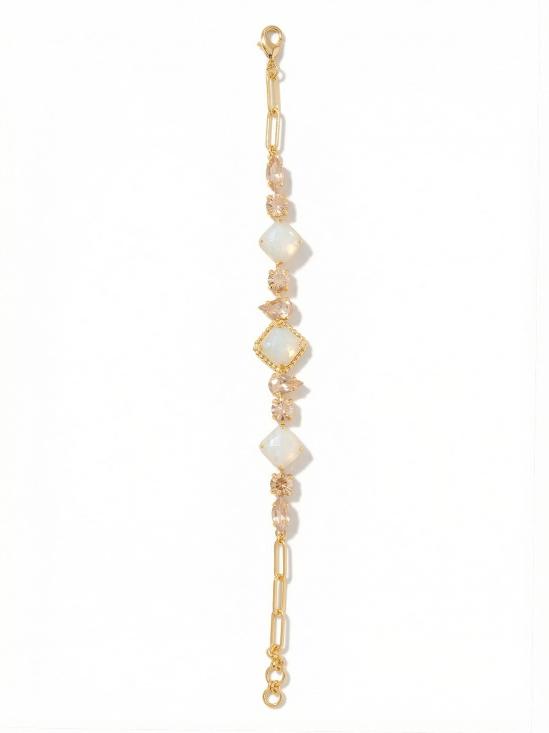 Izzy Tennis Bracelet - BFY40BGGGO - <p>Warm, golden light reflects from an unexpected arrangement of pear, marquise, round, and square-cut crystals. Rather than a traditional single row, this design integrates textural ball and paperclip chains alongside a classic channel setting. The interplay of smooth metal and varied crystal facets catches the light beautifully in motion. Built with an extension chain, the fit adjusts to your exact preference, keeping the clasp secure and the varied links perfectly aligned as you move through the day.</p><ul>
<li>Architectural mix of paperclip and classic ball chains</li>
<li>Dynamic arrangement of pear, round, marquise, and square crystals</li>
<li>Lobster claw clasp</li>
<li>3/4-inch adjustable extension chain</li>
<li>Protective e-coat finish for lasting wear</li>
<li>Includes signature organza pouch for gifting and travel</li>
</ul>