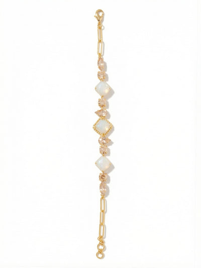 Izzy Tennis Bracelet - BFY40BGGGO - <p>Warm, golden light reflects from an unexpected arrangement of pear, marquise, round, and square-cut crystals. Rather than a traditional single row, this design integrates textural ball and paperclip chains alongside a classic channel setting. The interplay of smooth metal and varied crystal facets catches the light beautifully in motion. Built with an extension chain, the fit adjusts to your exact preference, keeping the clasp secure and the varied links perfectly aligned as you move through the day.</p><ul>
<li>Architectural mix of paperclip and classic ball chains</li>
<li>Dynamic arrangement of pear, round, marquise, and square crystals</li>
<li>Lobster claw clasp</li>
<li>3/4-inch adjustable extension chain</li>
<li>Protective e-coat finish for lasting wear</li>
<li>Includes signature organza pouch for gifting and travel</li>
</ul>