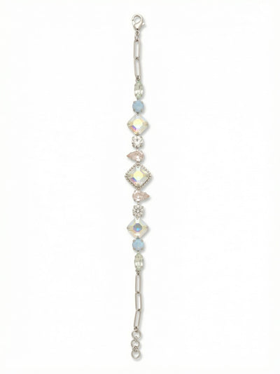 Izzy Tennis Bracelet - BFY40PDRQ - <p>A departure from the uniform tennis style, this piece builds visual rhythm through alternating crystal cuts. A central square aurora borealis crystal anchors an intricate sequence of silk pear shapes, cloudy blue opals, and slender marquise stones. The shifting scale creates continuous movement as the bracelet catches the light on your arm. At each end, the setting transitions smoothly into a modern paperclip chain, while the extension links allow you to adjust the drape exactly where you want it.</p><ul>
<li>Symmetrical sequence combining square, pear, round, and marquise crystals</li>
<li>Tapered crystal settings transition into a sleek paperclip chain</li>
<li>Lobster claw clasp</li>
<li>3/4-inch adjustable extension chain</li>
<li>Protective e-coat finish for lasting wear</li>
<li>Includes signature organza pouch for gifting and travel</li>
</ul>