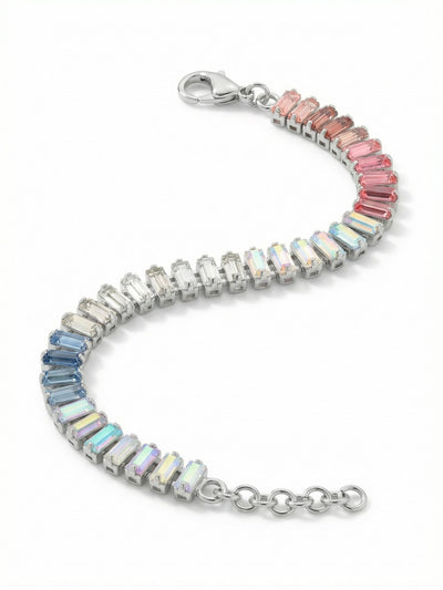 Bianca Tennis Bracelet - BFY55PDPBZ - <p>Slim baguette crystals form a continuous line of color, shifting gently from soft rose through crystal aurora borealis and into cool sapphire hues. The step-cut faceting provides a clean, linear flash of light as your wrist moves. Built on a highly flexible channel chain, this piece drapes with a liquid ease. An integrated extension chain lets you find the exact right fit, whether you wear it closely tailored or layered loosely with other favorites.</p><ul>
<li>Seamless gradient transitions from warm pink to cool sapphire</li>
<li>Architectural baguette-cut crystals cast sharp linear reflections</li>
<li>Lobster claw clasp</li>
<li>3/4-inch adjustable extension chain</li>
<li>Protective e-coat finish for lasting wear</li>
<li>Includes signature organza pouch for gifting and travel</li>
</ul>