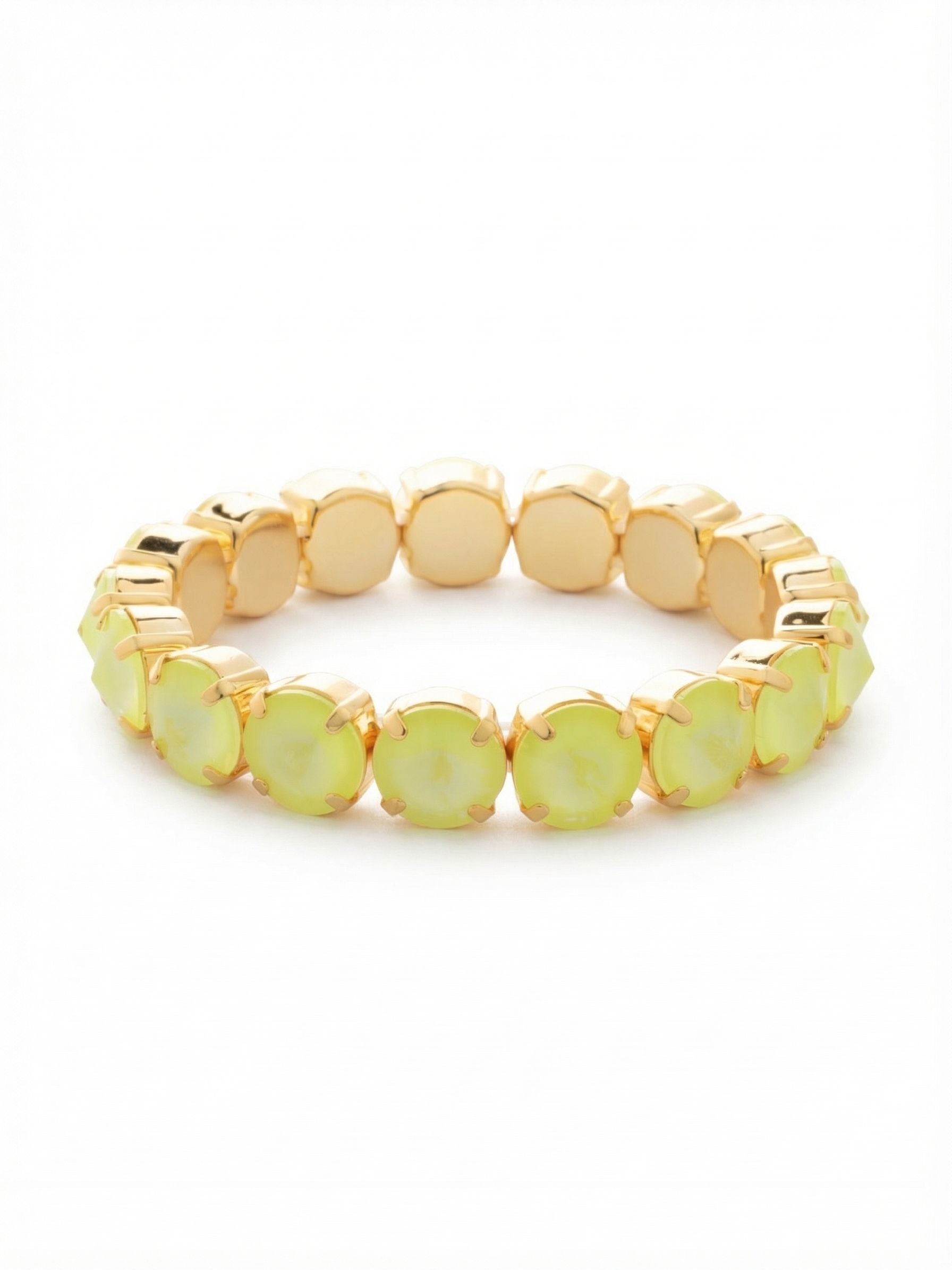 London Stretch Bracelet - BFY8BGELY - <p>A continuous band of electric yellow stones gives this bracelet an immediate energy. Each round crystal is faceted to a distinct point, creating a textured surface that catches the light as you move. The stretch design rolls easily over your hand, adapting to your movement with comfortable, flexible give. At half an inch wide, it carries enough visual weight to hold its own alongside a classic watch, adding a sharp dose of color to your daily stack.</p><ul>
<li>Continuous band of faceted round crystals with elevated points</li>
<li>Flexible stretch construction rolls easily over the hand</li>
<li>Stretch easy slip-on design</li>
<li>Protective e-coat finish for lasting wear</li>
<li>Includes signature organza pouch for gifting and travel</li>
</ul>
