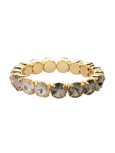 London Stretch Bracelet - BFY8BGEM - <p>The London Stretch Bracelet features a line of rivoli round-cut crystals on a sturdy jewelers' filament, stretching to fit most wrists comfortably, without the hassle of a clasp! (7 inches in diameter, fits average wrist sizes) From Sorrelli's Evening Moon collection in our Bright Gold-tone finish.</p>