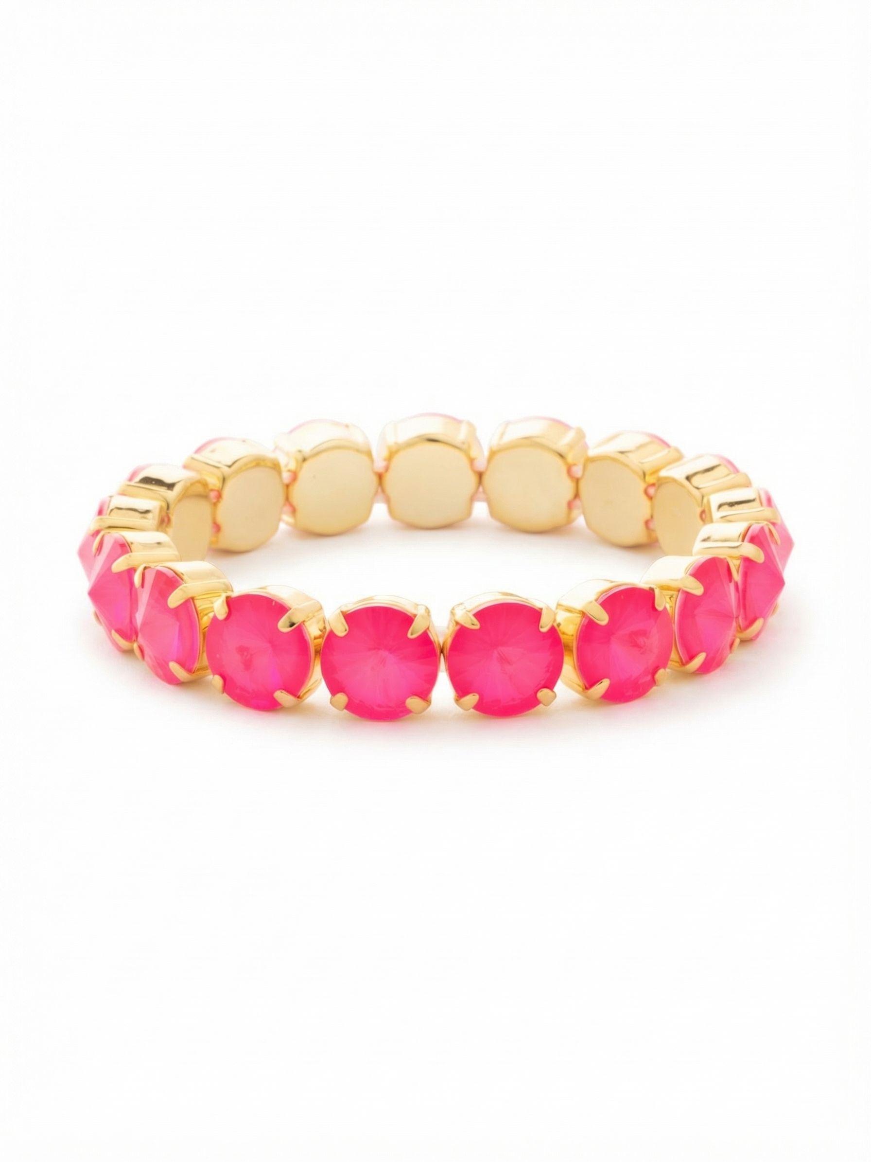London Stretch Bracelet - BFY8BGETP - <p>Substantial round crystals create an unbroken circle of vivid pink that shifts and glows with every movement. Bright gold-tone cups frame the oversized stones, giving the piece a satisfying weight and a clean silhouette. The hidden stretch construction lets you slide it over your hand in a single motion, completely bypassing the fuss of traditional clasps. It serves effortlessly as a bold, saturated anchor in a layered stack or a confident punch of color worn entirely on its own.</p><ul>
<li>Substantial round crystals create an unbroken band of saturated color</li>
<li>Flexible stretch construction adapts instantly to your daily movements</li>
<li>Stretch easy slip-on design</li>
<li>Protective e-coat finish for lasting wear</li>
<li>Includes signature organza pouch for gifting and travel</li>
</ul>
