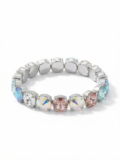 London Stretch Bracelet - BFY8PDRQ - <p>Slipping on this bracelet takes a single fluid movement, offering an immediate reward of substantial weight. Seventeen large round crystals form an unbroken circle around your arm, catching light through a prismatic mix of cool opal blues, soft blush, and clear iridescent tones. The concealed stretch construction means no fumbling with one-handed clasps, allowing the continuous band to adapt comfortably to your movement throughout the day. It layers effortlessly with delicate chains or stands perfectly well on its own.</p><ul>
<li>Interlocking round crystals create an unbroken half-inch band of light</li>
<li>Alternating warm blush and cool opal tones shift organically in the light</li>
<li>Stretch easy slip-on design</li>
<li>Protective e-coat finish for lasting wear</li>
<li>Includes signature organza pouch for gifting and travel</li>
</ul>