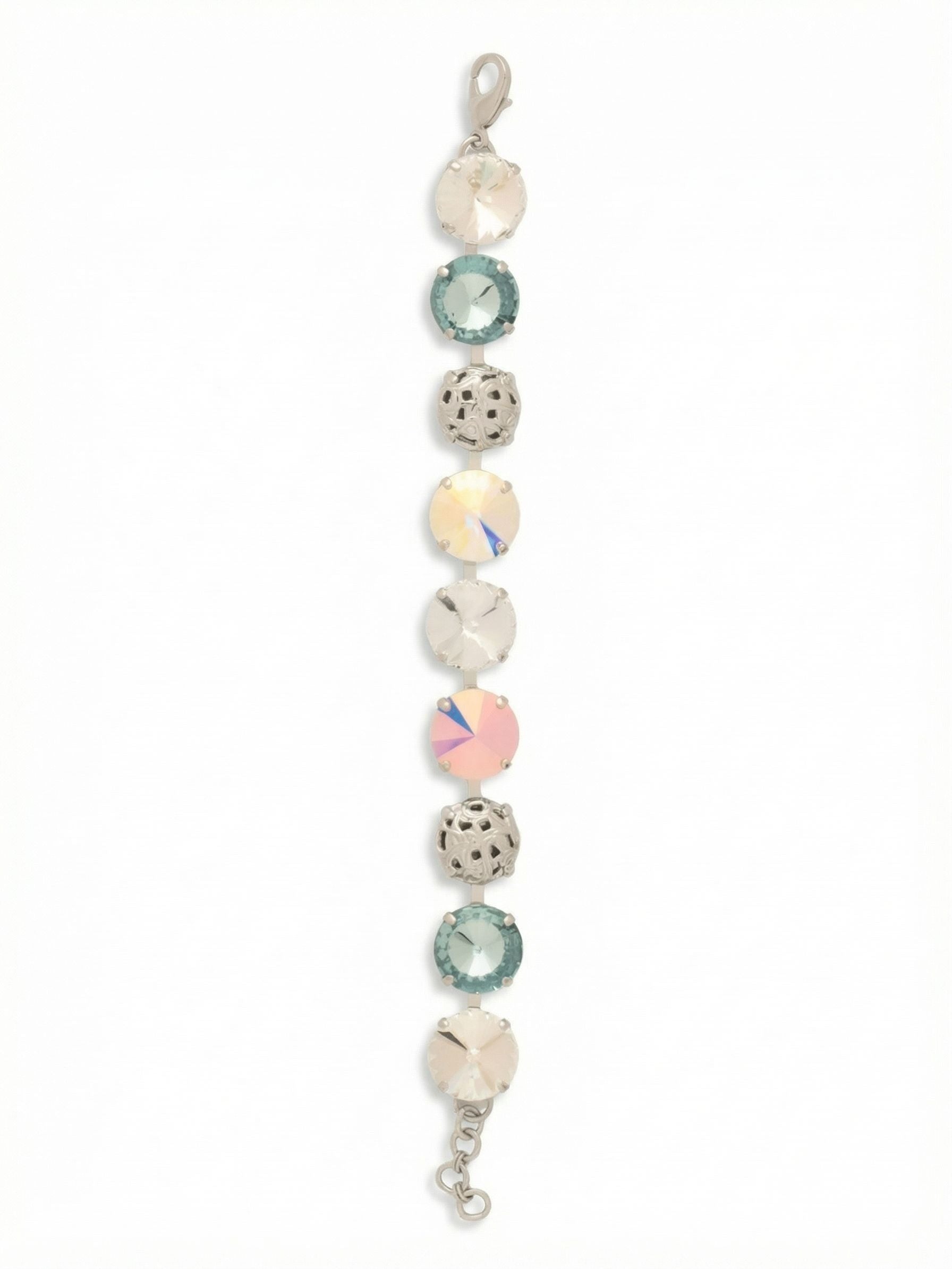 Clementine Tennis Bracelet - BFZ180PDRQ - <p>A substantial take on the traditional line bracelet, the Clementine alternates oversized iridescent crystals with intricately cast metal spheres. The half-inch width provides a grounding weight that follows the natural movement of your arm. Smooth, light-catching facets contrast with the tactile openwork metal to create a complex rhythm of texture and reflection. With an extension chain to easily tailor the drape, it serves as a self-assured anchor for a stack or an intricate standalone piece.</p><ul>
<li>Alternating sequence of oversized crystals and openwork metal spheres creates a highly tactile profile</li>
<li>Substantial half-inch width provides a grounding weight and distinct visual rhythm</li>
<li>Lobster claw clasp</li>
<li>3/4-inch adjustable extension chain</li>
<li>Protective e-coat finish for lasting wear</li>
<li>Includes signature organza pouch for gifting and travel</li>
</ul>