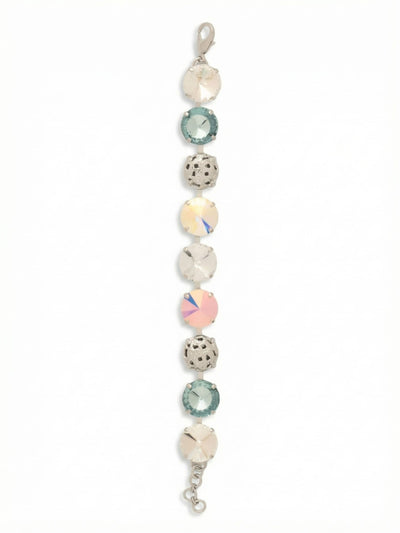 Clementine Tennis Bracelet - BFZ180PDRQ - <p>A substantial take on the traditional line bracelet, the Clementine alternates oversized iridescent crystals with intricately cast metal spheres. The half-inch width provides a grounding weight that follows the natural movement of your arm. Smooth, light-catching facets contrast with the tactile openwork metal to create a complex rhythm of texture and reflection. With an extension chain to easily tailor the drape, it serves as a self-assured anchor for a stack or an intricate standalone piece.</p><ul>
<li>Alternating sequence of oversized crystals and openwork metal spheres creates a highly tactile profile</li>
<li>Substantial half-inch width provides a grounding weight and distinct visual rhythm</li>
<li>Lobster claw clasp</li>
<li>3/4-inch adjustable extension chain</li>
<li>Protective e-coat finish for lasting wear</li>
<li>Includes signature organza pouch for gifting and travel</li>
</ul>