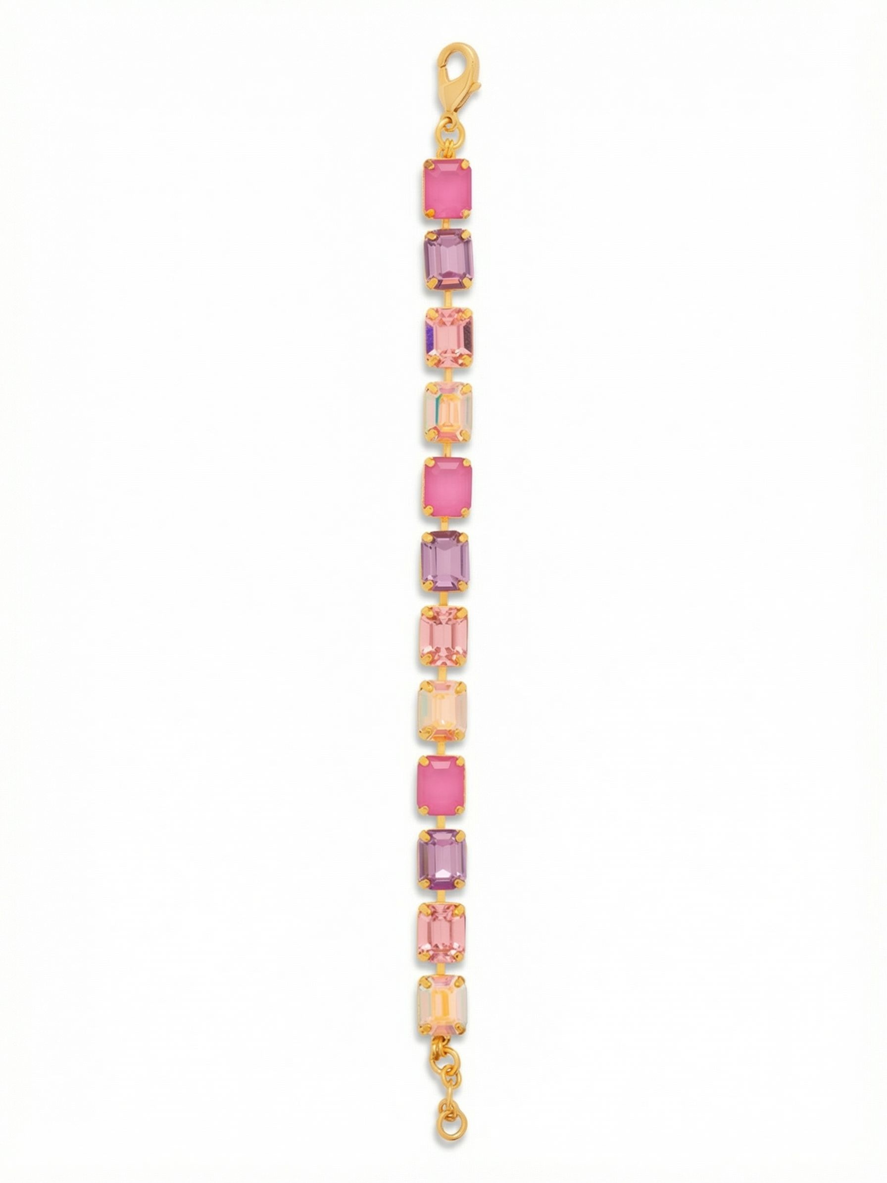 Octavia Repeating Tennis Bracelet - BFZ6BGPRO - <p>Twelve emerald-cut crystals form a continuous band of vibrant color. The clean step-cut facets catch light in broad, deliberate flashes as your arm moves. Set in an articulated kette chain, the stones maintain a steady rhythm of warm pinks, soft violets, and iridescent shifts. An included extension chain lets you find the right degree of drape, easily adapting from a close fit to a looser stack with your everyday pieces.</p><ul>
<li>Emerald-cut crystals in a repeating color sequence</li>
<li>Articulated kette chain allows fluid movement</li>
<li>Lobster claw clasp</li>
<li>3/4-inch adjustable extension chain</li>
<li>Protective e-coat finish for lasting wear</li>
<li>Includes signature organza pouch for gifting and travel</li>
</ul>
