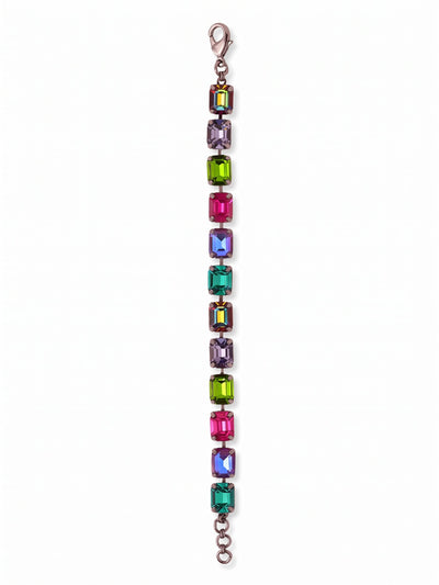 Octavia Repeating Tennis Bracelet - BFZ6GMNNI - <p>Deep, saturated color takes on a structured edge in this vibrant tennis bracelet. Twelve substantial emerald-cut crystals create a bold sequence of rich tones, moving from vivid fuchsia to deep tanzanite and olivene. The flexible kette chain construction allows the piece to articulate fluidly as your hand moves, letting the broad geometric facets catch the light in wide flashes. Finished with an extension chain, you can adjust the drape to your exact preference.</p><ul>
<li>Substantial emerald-cut crystals offer a bold geometric profile</li>
<li>Flexible chain construction allows natural articulation with movement</li>
<li>Lobster claw clasp</li>
<li>3/4-inch adjustable extension chain</li>
<li>Includes signature organza pouch for gifting and travel</li>
</ul>