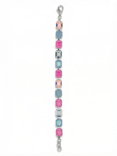 Octavia Repeating Tennis Bracelet - BFZ6PDPBZ - <p>A continuous line of emerald-cut crystals creates a steady visual rhythm on the arm. Alternating cool blues and soft pinks catch the light with every gesture, bringing a deliberate wash of color to your daily routine. Built on a linked channel chain, the stones maintain constant, fluid movement as you go about your day. An integrated extension chain lets you adjust the length, allowing the piece to drape exactly how you want it to.</p><ul>
<li>Continuous row of uniform emerald cut crystals</li>
<li>Articulated channel setting for fluid movement</li>
<li>Lobster claw clasp</li>
<li>3/4-inch adjustable extension chain</li>
<li>Protective e-coat finish for lasting wear</li>
<li>Includes signature organza pouch for gifting and travel</li>
</ul>