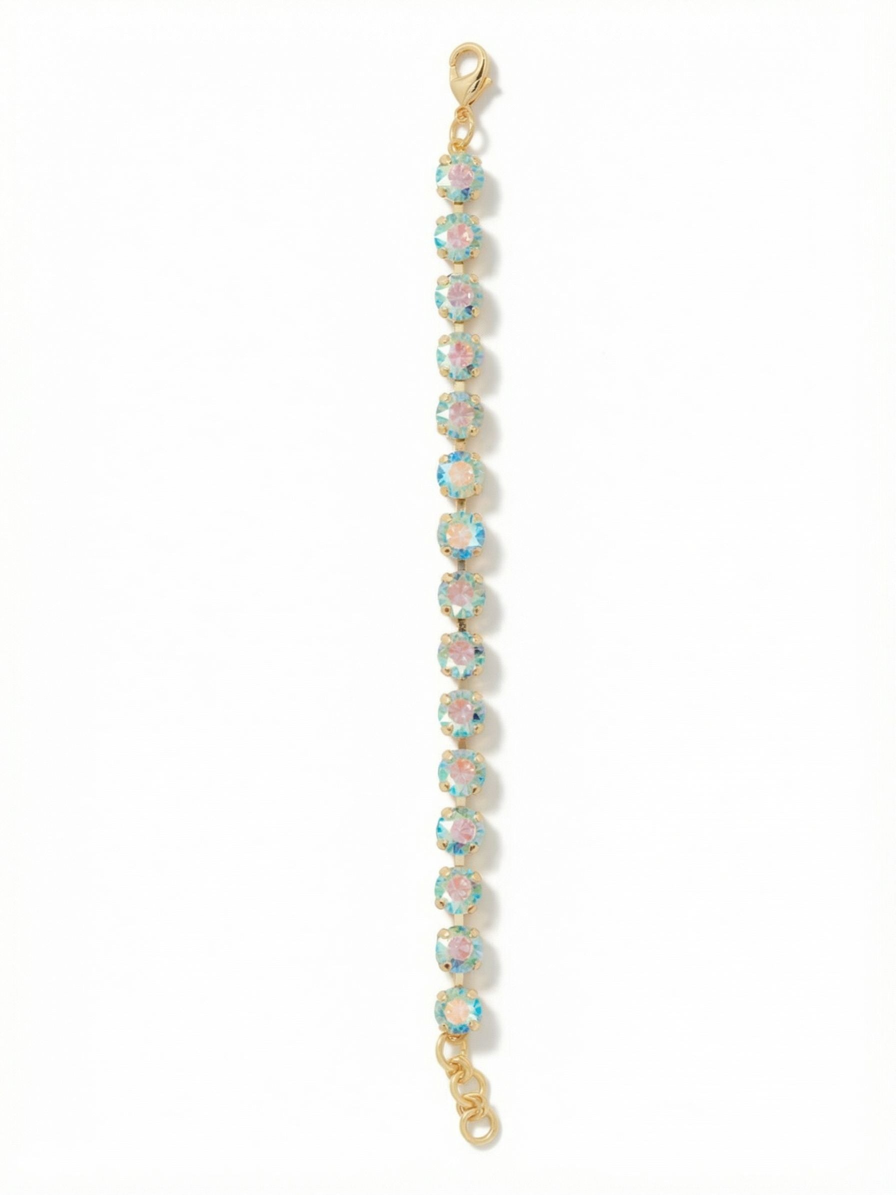 Sienna Tennis Bracelet - BGA2BGAQA - <p>A continuous line of aquamarine crystals circles the wrist, catching the light with a distinct iridescent shift. The aurora borealis coating reveals subtle flashes of pink and cool blue against the bright gold-tone setting with every gesture. Built on a flexible channel chain, the bracelet moves naturally with your arm as you go about your day. An extension chain allows you to adjust the fit exactly how you prefer it.</p><ul>
<li>Round-cut crystals treated with an iridescent color-shifting coating</li>
<li>Flexible channel chain construction for natural movement</li>
<li>Lobster claw clasp</li>
<li>3/4-inch adjustable extension chain</li>
<li>Protective e-coat finish for lasting wear</li>
<li>Includes signature organza pouch for gifting and travel</li>
</ul>