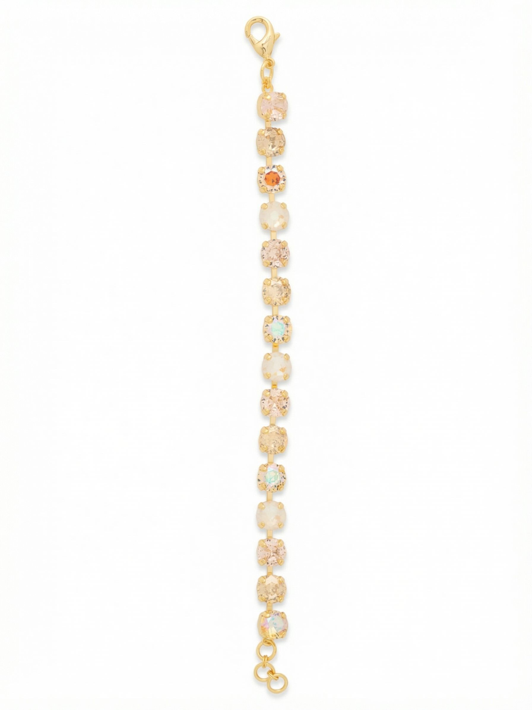 Sienna Tennis Bracelet - BGA2BGGGO - <p>Warm, round-cut crystals in champagne, vintage rose, and bright aurora borealis form an unbroken line of light. Built on a flexible channel chain, the stones maintain a perfectly aligned sequence while adapting naturally to your shape as you move. This piece brings subtle warmth to your daily rotation, working just as well as a solitary accent or mixed into a layered stack. A short extension chain lets you find the exact right fit for continuous wear.</p><ul>
<li>Alternating warm crystal tones and iridescent aurora borealis create a dynamic color shift</li>
<li>Flexible channel chain construction keeps the round stones facing outward in motion</li>
<li>Lobster claw clasp</li>
<li>3/4-inch adjustable extension chain</li>
<li>Protective e-coat finish for lasting wear</li>
<li>Includes signature organza pouch for gifting and travel</li>
</ul>