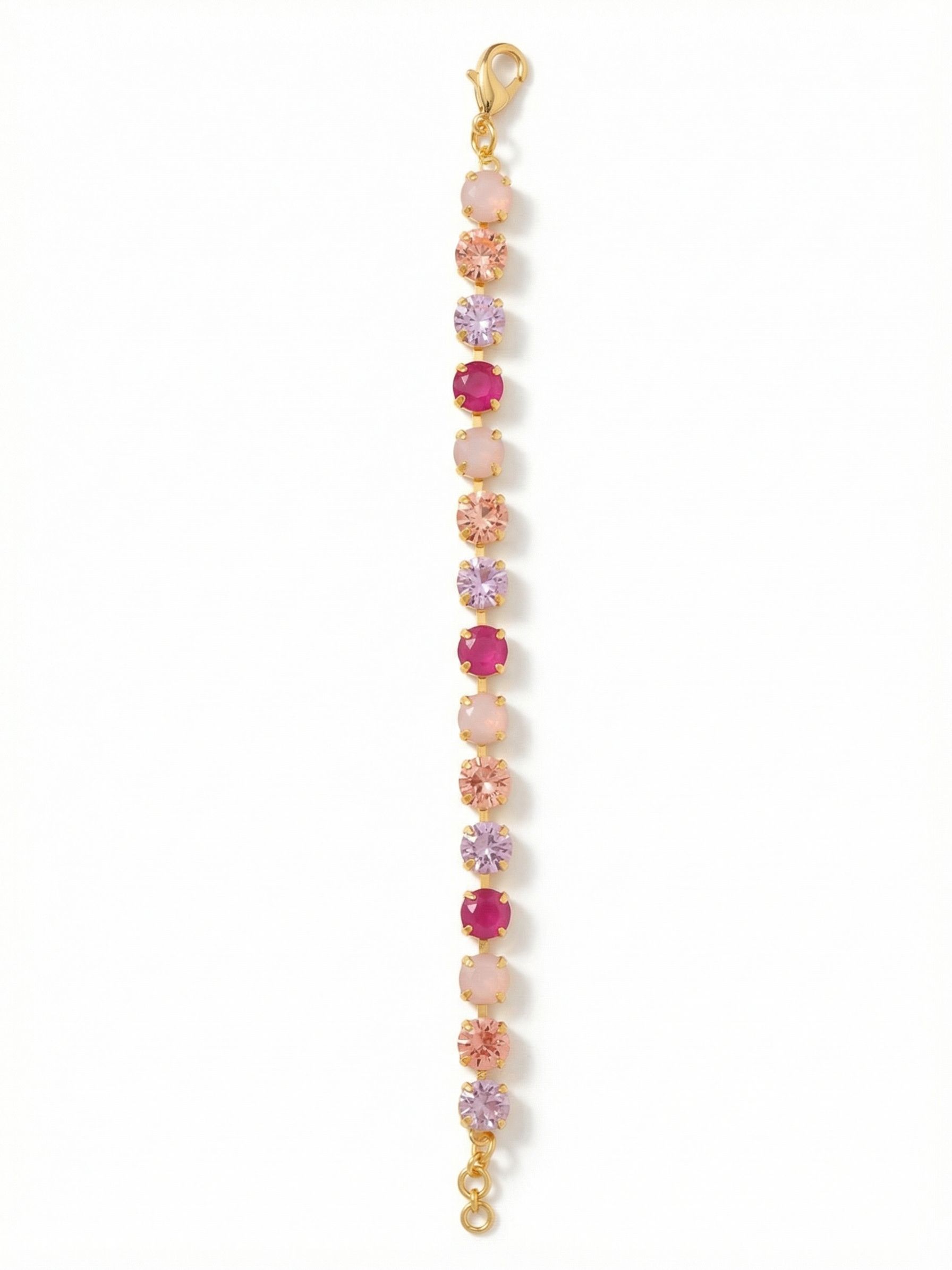 Sienna Tennis Bracelet - BGA2BGPRO - <p>An unbroken ribbon of varied pink tones wraps the wrist in fluid color. The continuous crystal channel construction allows each round-cut stone to articulate independently, moving easily as you type, reach, and gesture throughout the day. With an included extension chain, you can easily customize the length to find your ideal drape. This piece layers effortlessly next to a daily watch or stands out on its own as a distinct, deliberate touch of warmth.</p><ul>
<li>Continuous band of alternating soft opal and vivid pink crystals</li>
<li>Flexible chain construction allows the stones to move naturally with the wrist</li>
<li>Lobster claw clasp</li>
<li>3/4-inch adjustable extension chain</li>
<li>Protective e-coat finish for lasting wear</li>
<li>Includes signature organza pouch for gifting and travel</li>
</ul>