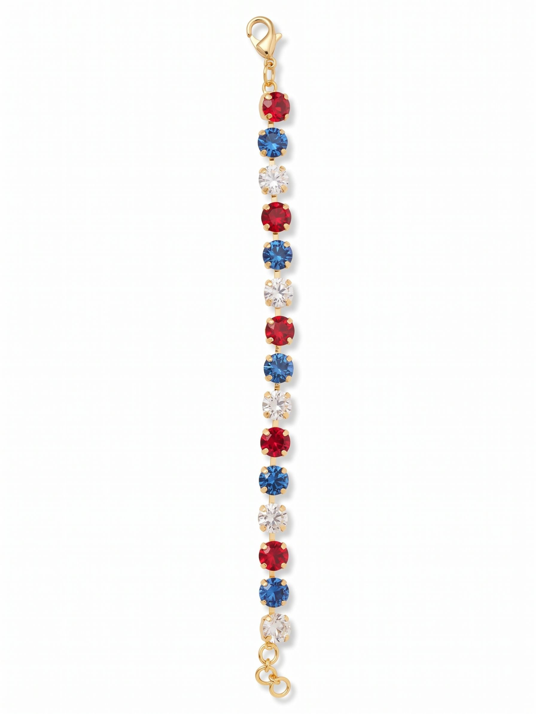 Sienna Tennis Bracelet - BGA2BGUSA - <p>A fluid line of bold color brings a distinct visual rhythm to your daily rotation. Round-cut crystals alternate in saturated tones of rich red, deep sapphire, and crisp clear crystal, all anchored by a bright gold-tone setting. The flexible kette chain construction allows the piece to drape naturally and move with your hand. An adjustable extension chain lets you dial in the exact fit, keeping the stones facing up whether worn alone or tucked into a mixed metal stack.</p><ul>
<li>Repeating tri-color crystal pattern in an even round-cut line</li>
<li>Flexible crystal-set channel chain designed for fluid movement</li>
<li>Lobster claw clasp</li>
<li>3/4-inch adjustable extension chain</li>
<li>Protective e-coat finish for lasting wear</li>
<li>Includes organza pouch for gifting and travel</li>
</ul>