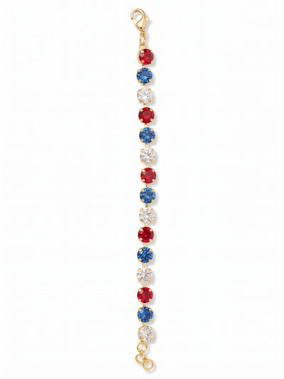 Sienna Tennis Bracelet - BGA2BGUSA - <p>A fluid line of bold color brings a distinct visual rhythm to your daily rotation. Round-cut crystals alternate in saturated tones of rich red, deep sapphire, and crisp clear crystal, all anchored by a bright gold-tone setting. The flexible kette chain construction allows the piece to drape naturally and move with your hand. An adjustable extension chain lets you dial in the exact fit, keeping the stones facing up whether worn alone or tucked into a mixed metal stack.</p><ul>
<li>Repeating tri-color crystal pattern in an even round-cut line</li>
<li>Flexible crystal-set channel chain designed for fluid movement</li>
<li>Lobster claw clasp</li>
<li>3/4-inch adjustable extension chain</li>
<li>Protective e-coat finish for lasting wear</li>
<li>Includes organza pouch for gifting and travel</li>
</ul>