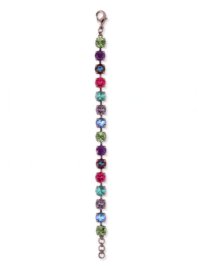 Sienna Tennis Bracelet - BGA2GMNNI - <p>An unbroken row of uniformly sized round crystals creates a flexible band of saturated color. Set in dark gunmetal, the vibrant mix of tanzanite, fuchsia, and emerald tones catches the light with every movement of your hand. The articulated chain allows the bracelet to drape naturally and follow your gestures, while an adjustable extension ensures the proper fit. It brings a concentrated streak of deep, moody color to a simple watch stack or a bare arm.</p><ul>
<li>Uniform round crystals set in a rich multi-colored sequence</li>
<li>Flexible channel construction that moves fluidly with your gestures</li>
<li>Lobster claw clasp</li>
<li>3/4-inch adjustable extension chain</li>
<li>Includes organza pouch for gifting and travel</li>
</ul>