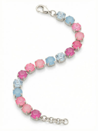 Sienna Tennis Bracelet - BGA2PDPBZ - <p>The channel chain construction creates a fluid line of color that wraps continuously and moves naturally with your arm. Round-cut crystals alternate in a deliberate rhythm, shifting from icy light sapphire and milky opal tones into vivid washes of electric and deep lacquer pink. The substantial palladium setting anchors the airy color palette, giving the piece a satisfying weight. An extension chain allows you to tailor the drape exactly to your preference.</p><ul>
<li>Fluid channel-set kette construction designed for continuous movement</li>
<li>Rhythmic color progression shifting from icy cool blues to vivid pinks</li>
<li>Lobster claw clasp</li>
<li>3/4-inch adjustable extension chain</li>
<li>Protective e-coat finish for lasting wear</li>
<li>Includes signature organza pouch for gifting and travel</li>
</ul>