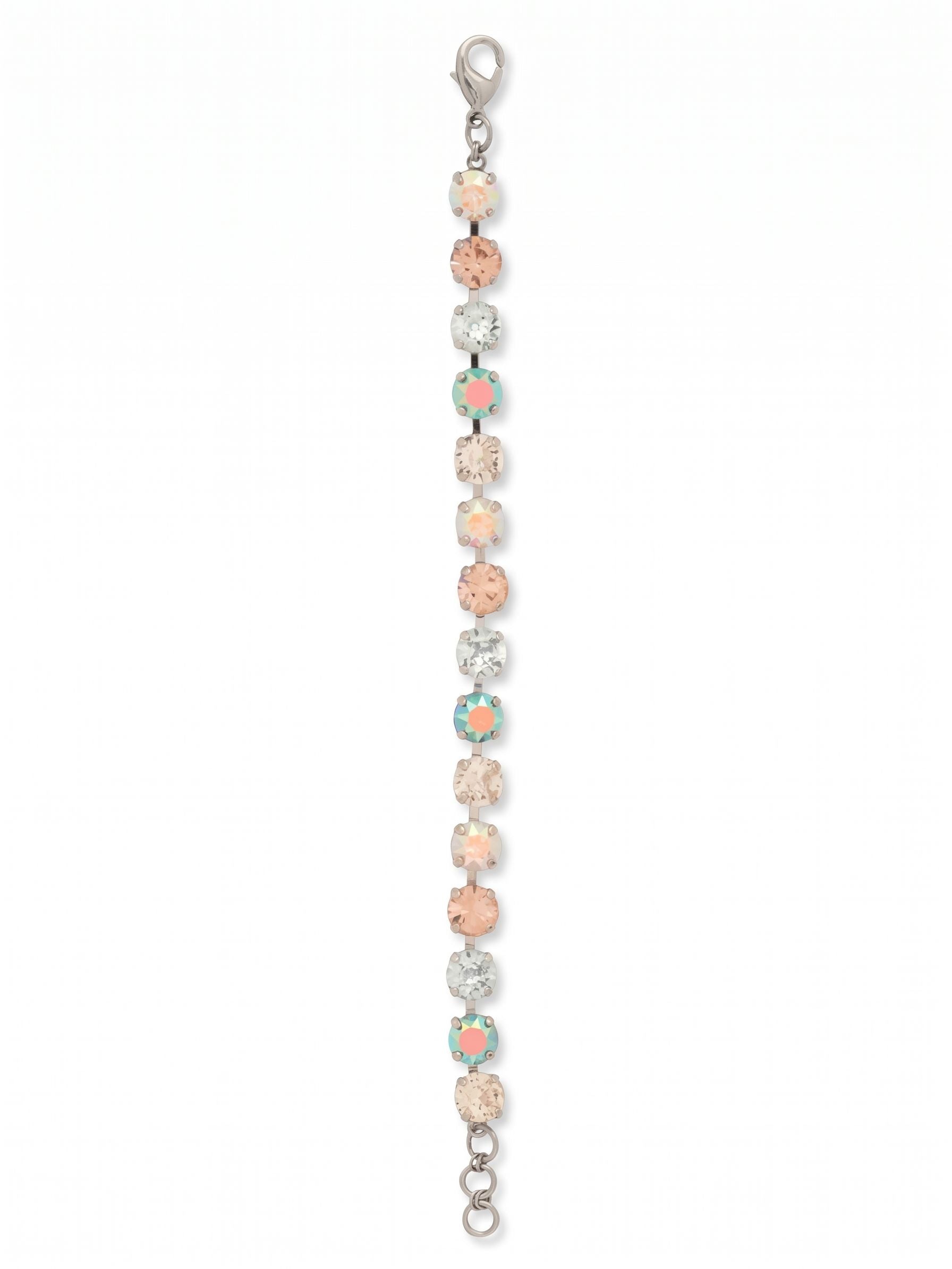 Sienna Tennis Bracelet - BGA2PDRQ - <p>A sequence of round-cut crystals creates a continuous ribbon of pale blues, soft pinks, and iridescent flashes along your arm. The flexible kette chain construction allows the piece to fluidly follow your movements as you reach across a desk or pour a glass of wine. An extension chain gives you control over the drape, letting you wear it comfortably snug or loose. It brings a quiet shift of color to an everyday watch or stands cleanly on its own.</p><ul>
<li>Alternating pastel and iridescent round-cut crystals in a fluid chain</li>
<li>A continuous sequence of evenly matched stones for uninterrupted color</li>
<li>Lobster claw clasp</li>
<li>3/4-inch adjustable extension chain</li>
<li>Protective e-coat finish for lasting wear</li>
<li>Includes signature organza pouch for gifting and travel</li>
</ul>