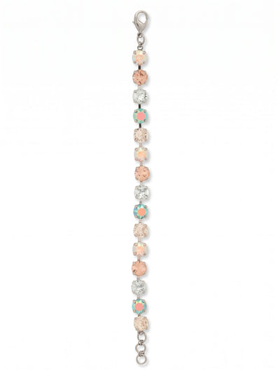 Sienna Tennis Bracelet - BGA2PDRQ - <p>A sequence of round-cut crystals creates a continuous ribbon of pale blues, soft pinks, and iridescent flashes along your arm. The flexible kette chain construction allows the piece to fluidly follow your movements as you reach across a desk or pour a glass of wine. An extension chain gives you control over the drape, letting you wear it comfortably snug or loose. It brings a quiet shift of color to an everyday watch or stands cleanly on its own.</p><ul>
<li>Alternating pastel and iridescent round-cut crystals in a fluid chain</li>
<li>A continuous sequence of evenly matched stones for uninterrupted color</li>
<li>Lobster claw clasp</li>
<li>3/4-inch adjustable extension chain</li>
<li>Protective e-coat finish for lasting wear</li>
<li>Includes signature organza pouch for gifting and travel</li>
</ul>