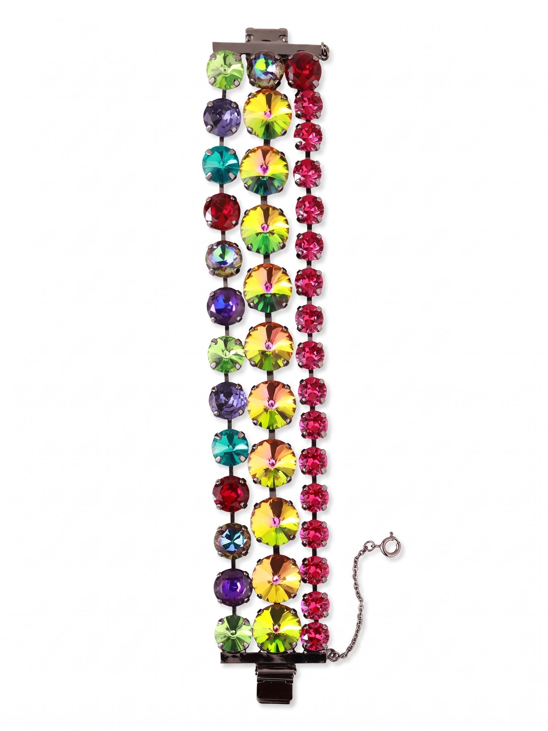 Penelope Layered Statement Bracelet - BGB4GMNNI - <p>Three parallel rows of crystals form a wide, flexible band that makes a strong visual impact without feeling stiff. A central line of oversized iridescent stones anchors the design, flanked by alternating jewel tones in slightly smaller proportions. Set in darkened metal, the highly saturated colors catch the light with every gesture. The linked construction gives the piece a satisfying weight while allowing it to move fluidly with your arm. A traditional box clasp with an attached safety chain keeps the substantial design securely in place.</p><ul>
<li>Three parallel crystal rows create a wide silhouette with a substantial feel</li>
<li>Oversized central stones anchor an alternating pattern of saturated jewel tones</li>
<li>Box clasp with secure safety chain</li>
<li>Includes organza pouch for gifting and travel</li>
</ul>