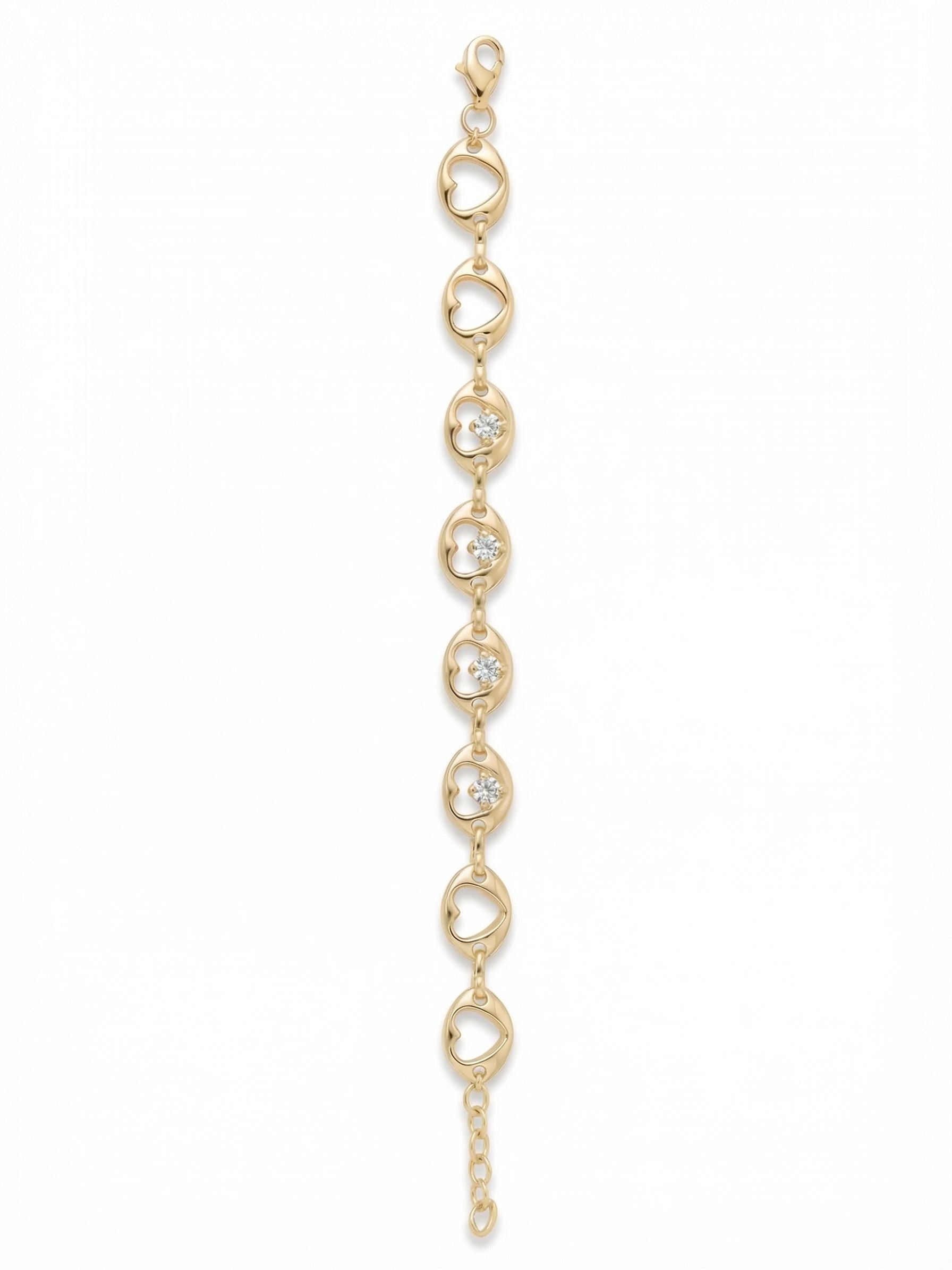 Tabitha Tennis Bracelet - BGF1BGCRY - <p>A delicate sequence of openwork heart links creates an airy, continuous line along the wrist. The bright metal moves fluidly as you go about your day, offering a comfortable and lightweight drape. Four central frames are each accented with a single, round-cut clear crystal, catching the light exactly where the top of the hand naturally rests. It provides a subtle gleam that layers easily with other chains or holds its own as a quiet, standalone detail.</p><ul>
<li>Continuous sequence of openwork heart silhouettes</li>
<li>Subtle round-cut crystals floating within the central four links</li>
<li>Lobster claw clasp</li>
<li>Protective e-coat finish for lasting wear</li>
<li>Includes signature organza pouch for gifting and travel</li>
</ul>