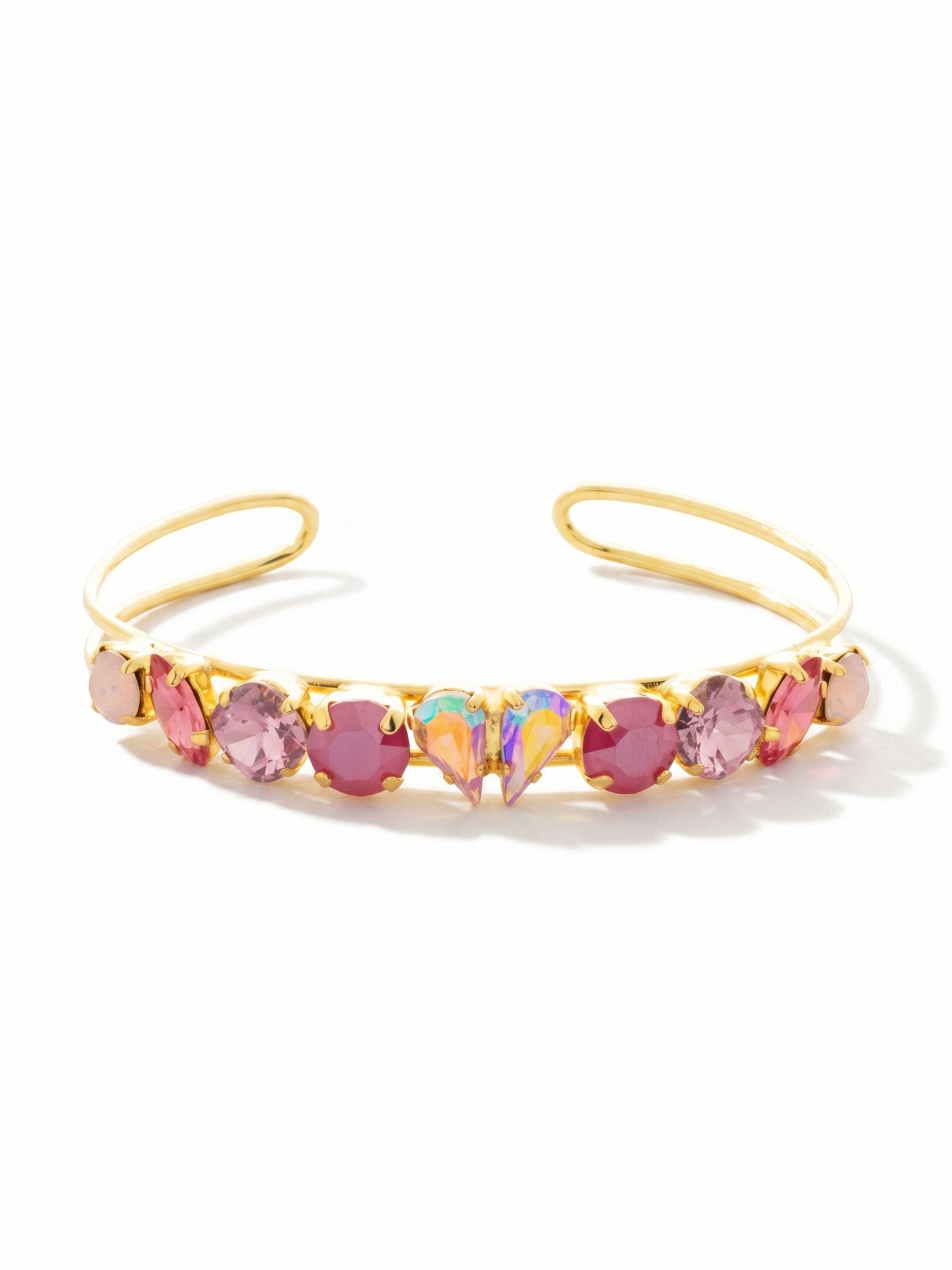 Beloved Adjustable Cuff Bracelet - BGF3BGPRO - <p>The thin, open-wire frame of this cuff allows it to slip on effortlessly and feel entirely weightless on your arm. At the center, two pear-cut iridescent crystals meet point-to-point, reflecting shifts of color with every movement of your hand. They are framed by a considered progression of milky opals, crisp marquise cuts, and saturated pink stones. The open design offers a gentle, flexible hold that moves naturally with you from morning meetings to evening dinners.</p><ul>
<li>Pear-cut crystals meet point-to-point to form an iridescent focal point</li>
<li>Mixed stone shapes taper gracefully outward along a slender open framework</li>
<li>Adjustable open cuff slides on easily</li>
<li>Protective e-coat finish for lasting wear</li>
<li>Includes signature organza pouch for gifting and travel</li>
</ul>