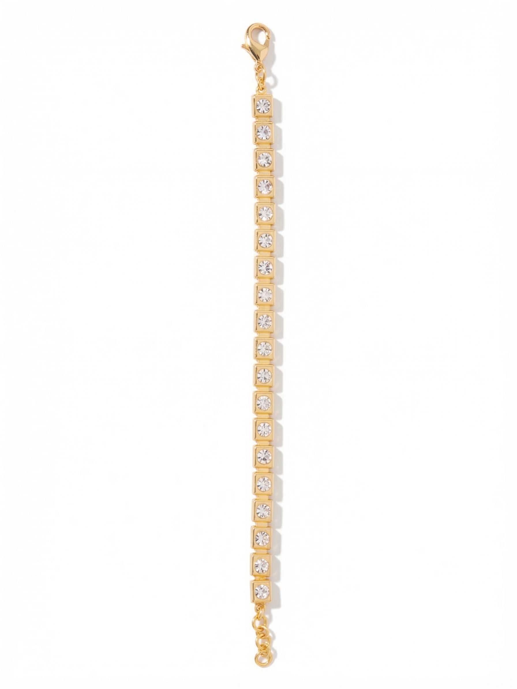 Max Tennis Bracelet - BGG1BGCRY - <p>A modern interpretation of a traditional silhouette. The Max Tennis Bracelet anchors round clear crystals within squared, polished links, creating a sharp geometric contrast. This subtle shift in construction gives the piece a substantial, architectural weight while maintaining the fluid, continuous movement expected from a line bracelet. The bright metal frames reflect light alongside the stones, making it a reliable daily anchor that layers easily beside a favorite watch.</p><ul>
<li>Squared metal links frame round crystals for an architectural profile</li>
<li>Articulated continuous construction allows for natural movement</li>
<li>Lobster claw clasp</li>
<li>3/4-inch adjustable extension chain</li>
<li>Protective e-coat finish for lasting wear</li>
<li>Includes signature organza pouch for gifting and travel</li>
</ul>