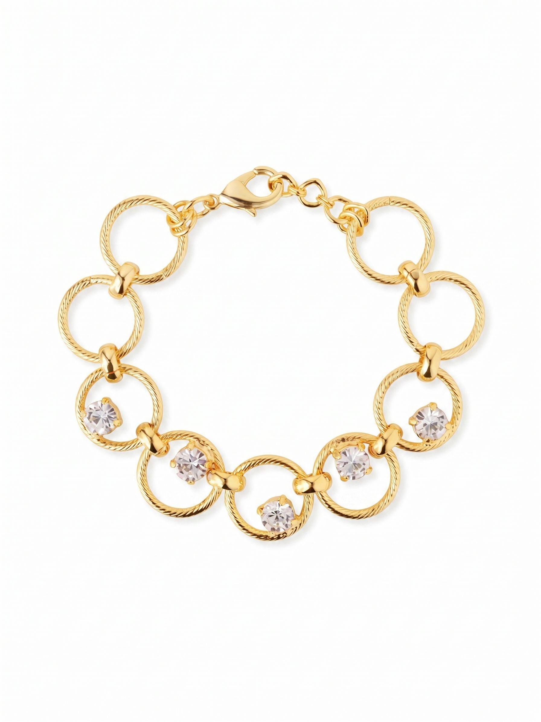 Odessa Tennis Bracelet - BGI1BGCRY - <p>A tactile take on the traditional line bracelet. Open rings of twisted metal flex fluidly with your every movement, securely joined by polished brackets. At the center of the design, five clear round-cut crystals are individually prong-set within the metalwork, creating an airy floating effect that catches light as you type or reach. The open-link construction gives this piece a generous scale without any extra weight, while an extension chain allows you to tailor the fit precisely.</p><ul>
<li>Round-cut crystals appear to float within open circular links</li>
<li>Textured rope-style metal rings offer tactile contrast</li>
<li>Lobster claw clasp</li>
<li>3/4-inch adjustable extension chain</li>
<li>Protective e-coat finish for lasting wear</li>
<li>Includes signature organza pouch for gifting and travel</li>
</ul>