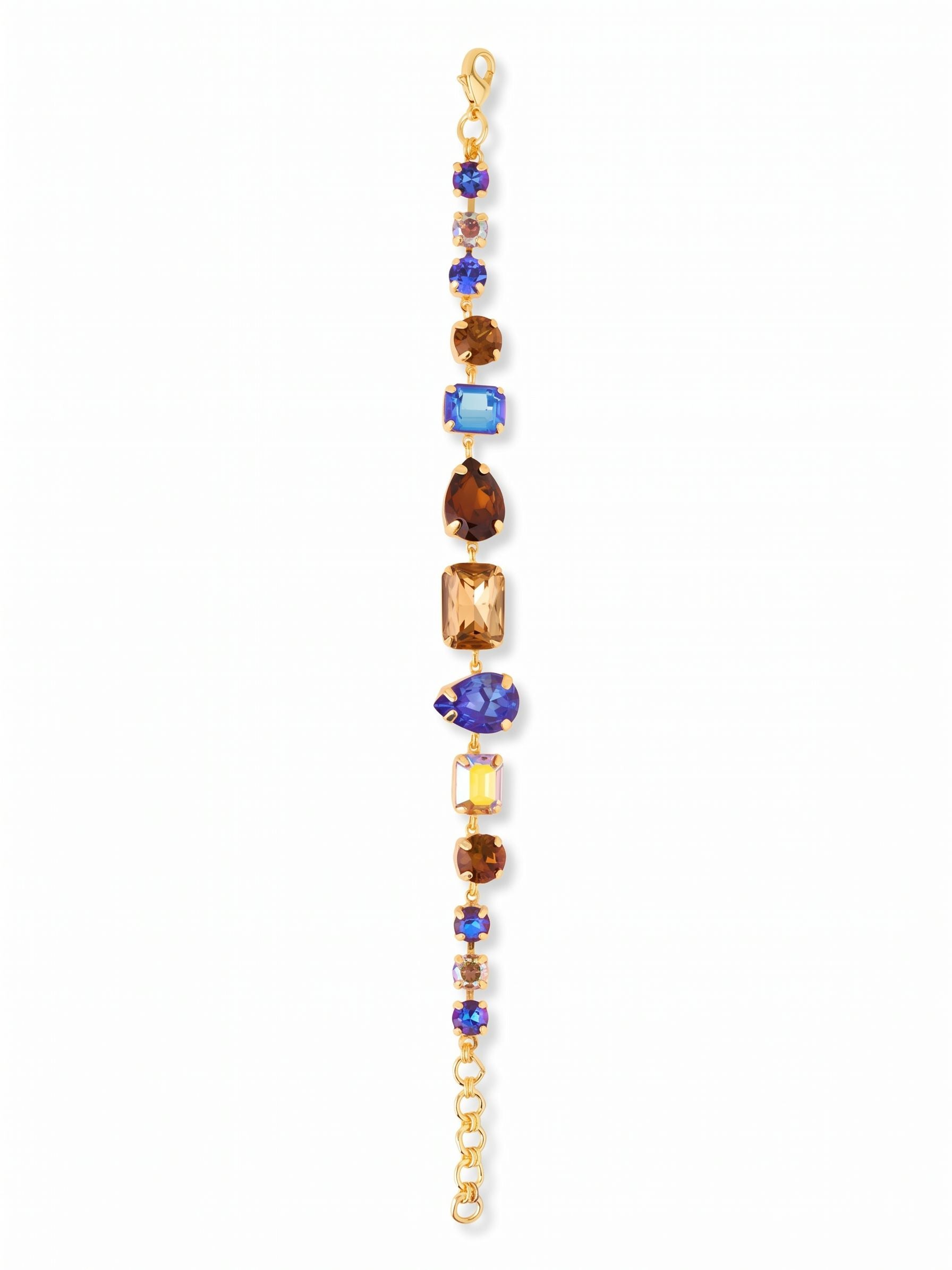 Moxie Tennis Bracelet - BGI30BGDNM - <p>Deep royal blues and earthy smoked topaz crystals create a bold, structured rhythm in this statement line bracelet. By mixing emerald, pear, and round cuts, the design catches light from multiple angles while the articulated channel chain flexes naturally with your every movement. The varied stone sizes build a substantial profile that easily holds its own next to a favorite watch. A short extension chain lets you find the right fit for your wrist.</p><ul>
<li>Mix of emerald, pear, and round crystal cuts</li>
<li>Articulated channel chain construction for flexible wear</li>
<li>Lobster claw clasp</li>
<li>3/4-inch adjustable extension chain</li>
<li>Protective e-coat finish for lasting wear</li>
<li>Includes organza pouch for gifting and travel</li>
</ul>