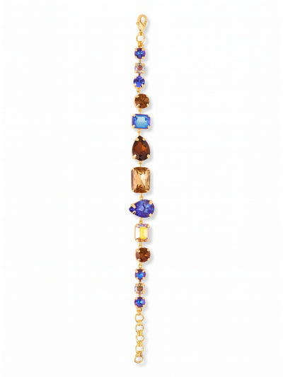 Moxie Tennis Bracelet - BGI30BGDNM - <p>Deep royal blues and earthy smoked topaz crystals create a bold, structured rhythm in this statement line bracelet. By mixing emerald, pear, and round cuts, the design catches light from multiple angles while the articulated channel chain flexes naturally with your every movement. The varied stone sizes build a substantial profile that easily holds its own next to a favorite watch. A short extension chain lets you find the right fit for your wrist.</p><ul>
<li>Mix of emerald, pear, and round crystal cuts</li>
<li>Articulated channel chain construction for flexible wear</li>
<li>Lobster claw clasp</li>
<li>3/4-inch adjustable extension chain</li>
<li>Protective e-coat finish for lasting wear</li>
<li>Includes organza pouch for gifting and travel</li>
</ul>