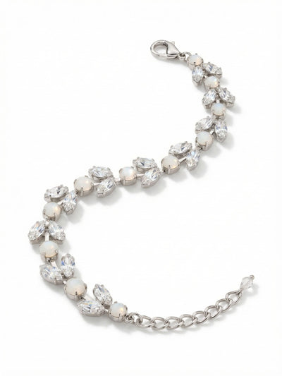Fern Tennis Bracelet - BGJ1PDCLA - <p>Round-cut white opals and angled marquise clear crystals are set along a flexible chain to create a delicate botanical motif. The milky opalescence contrasts quietly against the bright facets of the clear crystals, catching the light naturally as your wrist moves. Built on a fluid kette chain, the design drapes easily without feeling rigid or heavy. An adjustable extension chain lets you dial in the exact length, making it an easy piece to layer next to a favorite watch or wear entirely on its own.</p><ul>
<li>Alternating round opals and paired marquise crystals create a delicate botanical motif</li>
<li>Fluid kette chain construction ensures flexible movement</li>
<li>Lobster claw clasp</li>
<li>Protective e-coat finish for lasting wear</li>
<li>Includes signature organza pouch for gifting and travel</li>
</ul>