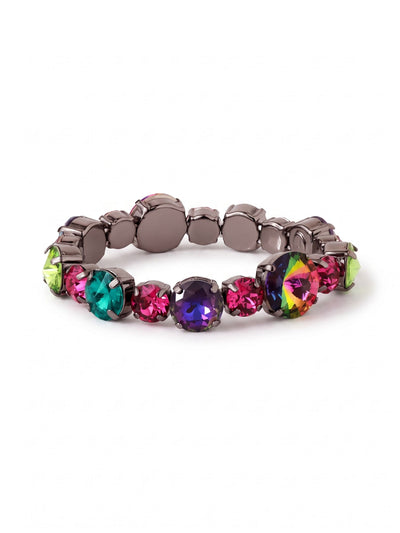 Lane Stretch Bracelet - BGL1GMNNI - <p>Deep gunmetal settings anchor a striking spectrum of vibrant round crystals. The heavy chain construction gives this stretch bracelet a satisfying, substantial weight as you roll it over your hand. Intense flashes of fuchsia, peridot, and iridescent volcano stones catch the light with every gesture. It delivers the visual impact of a structured statement piece with the easy slip-on wear of an elastic core, ready to wear solo or ground a heavier metal stack.</p><ul>
<li>Multi-sized round crystals create a varied rhythmic pattern along the band</li>
<li>Vibrant jewel tones contrast sharply against dark metal settings</li>
<li>Stretch easy slip-on design</li>
<li>Includes signature organza pouch for gifting and travel</li>
</ul>