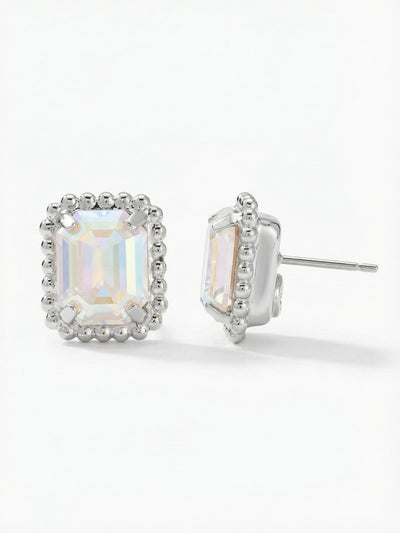 Octavia Scalloped Stud Earrings - EBW18PDCAB - <p>A single emerald-cut crystal throws broad flashes of iridescent light from the center of this architectural stud. Framed by a textured ball chain edge, the rectangular shape provides a clean, tailored geometry that reads clearly from across a table. Measuring a half-inch long, this piece brings substantial presence to your daily rotation. An oversized pressure-fit comfort back keeps the weight perfectly balanced, ensuring the crystal sits flush against the ear without drooping.</p><ul>
<li>Emerald-cut crystal offers broad flashes of iridescent color</li>
<li>Textured ball chain edge provides architectural framing</li>
<li>Post with oversized comfort-clutch back</li>
<li>Protective e-coat finish for lasting wear</li>
<li>Includes signature organza pouch for gifting and travel</li>
</ul>