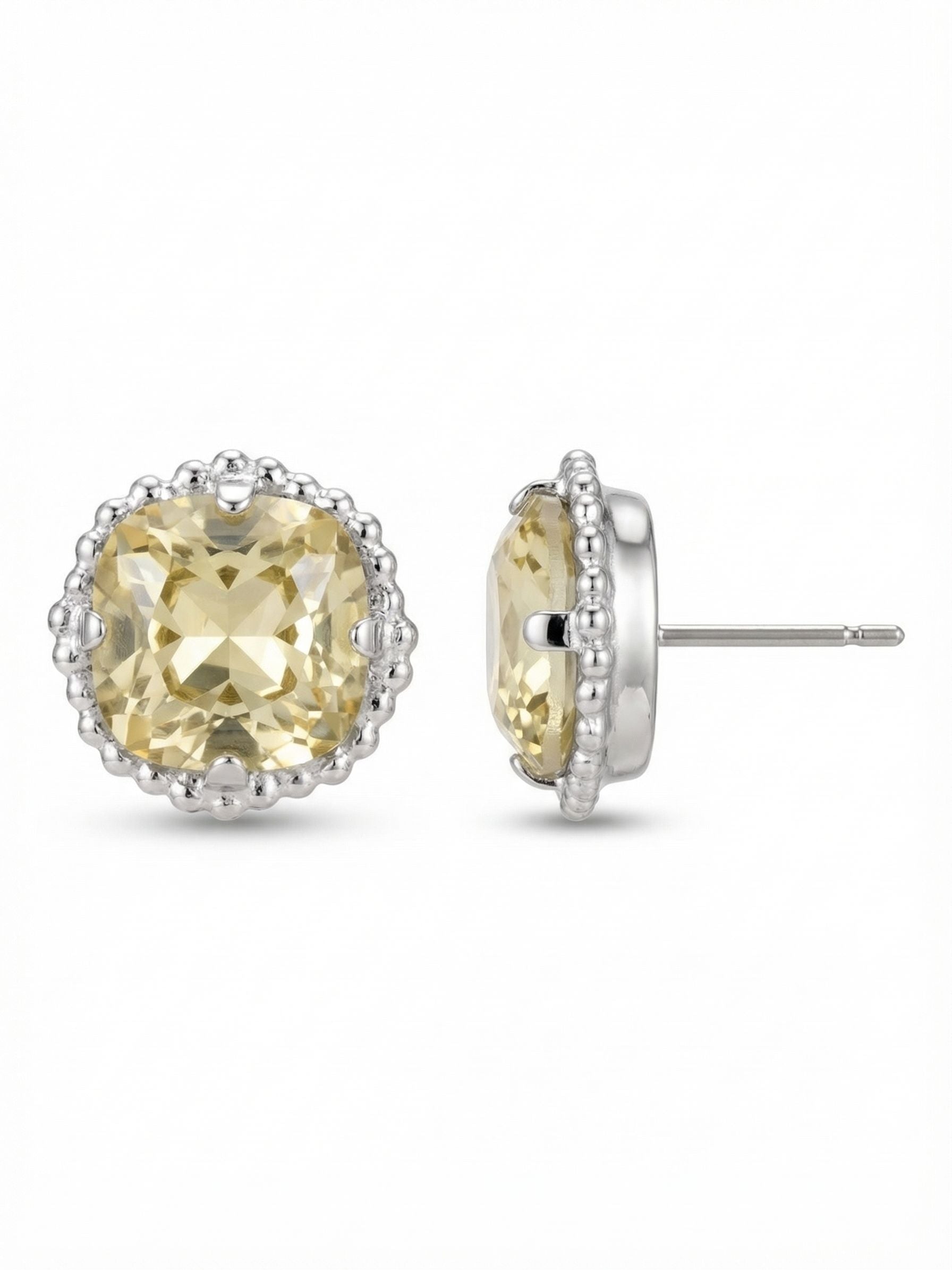 Cushion-Cut Solitaire Stud Earrings - EBX10PDJON - <p>A soft wash of pale yellow light illuminates the face with this substantial solitary stud. Centered on a 12mm cushion-cut crystal, the design is framed by a delicate beaded texture that gives the setting a tailored finish. It offers clear visual presence from across a table without feeling heavy. To keep the larger proportion sitting perfectly flat and secure all day, this earring includes an oversized comfort clutch that distributes the weight effortlessly.</p><ul>
<li>Textured beaded border framing the central stone</li>
<li>Substantial solitary profile for distinct visibility</li>
<li>Post with oversized comfort-clutch back</li>
<li>Protective e-coat finish for lasting wear</li>
<li>Includes signature organza pouch for gifting and travel</li>
</ul>