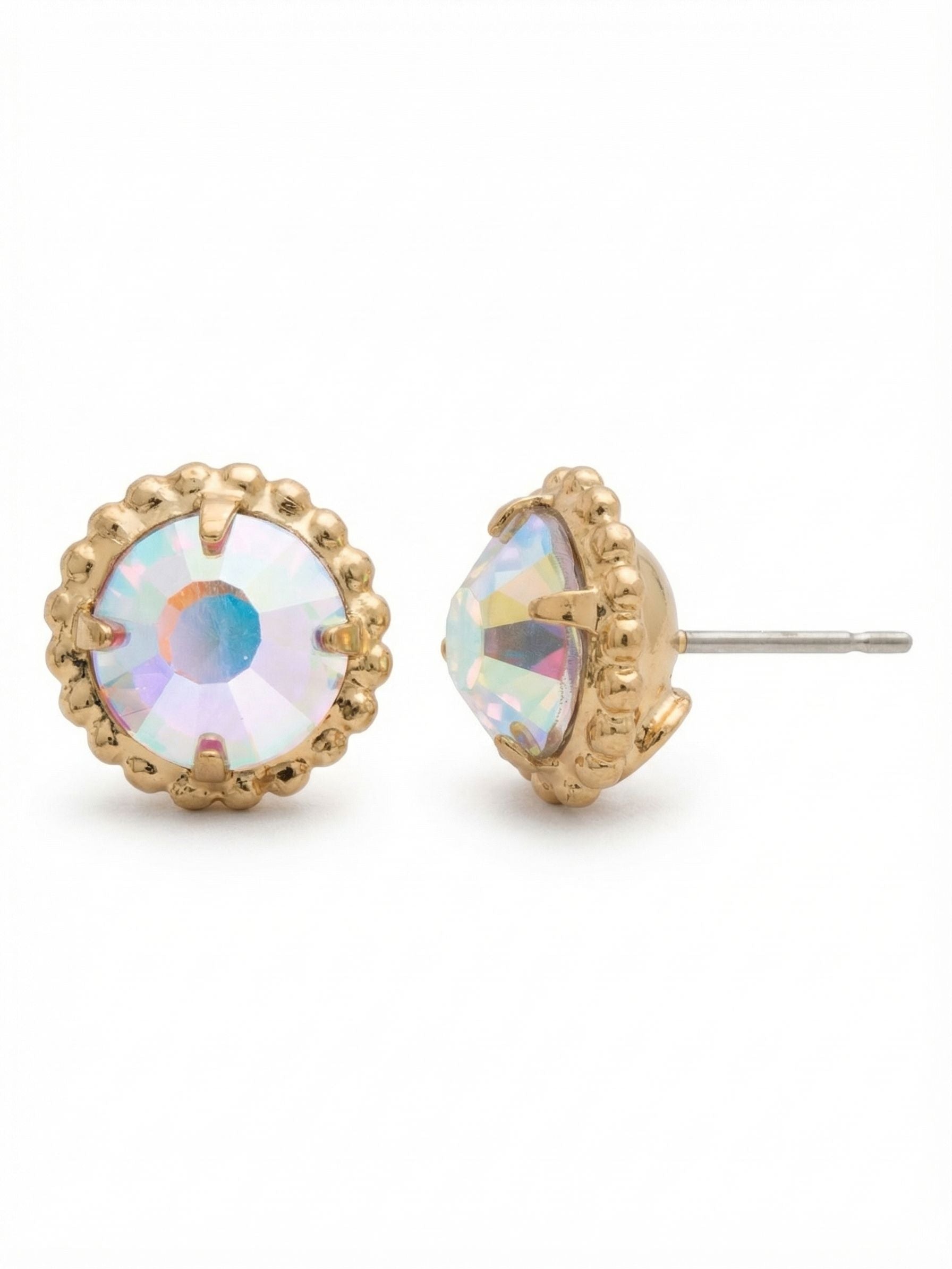 Simplicity Stud Earrings - EBY38BGCAB - <p>A single round crystal anchors these everyday studs, catching the light with soft shifts of pink, blue, and gold as you turn your head. We wrapped the center stone in a fine ball chain border to add quiet texture to the bright gold setting. Sized to be noticed without feeling heavy, they sit flush and secure against the ear all day thanks to an oversized comfort clutch that keeps them perfectly balanced.</p><ul>
<li>Round center crystal framed by a textured ball chain border</li>
<li>Color-shifting facets reflect soft iridescent tones</li>
<li>Post with oversized comfort-clutch back</li>
<li>Protective e-coat finish for lasting wear</li>
<li>Includes signature organza pouch for gifting and travel</li>
</ul>