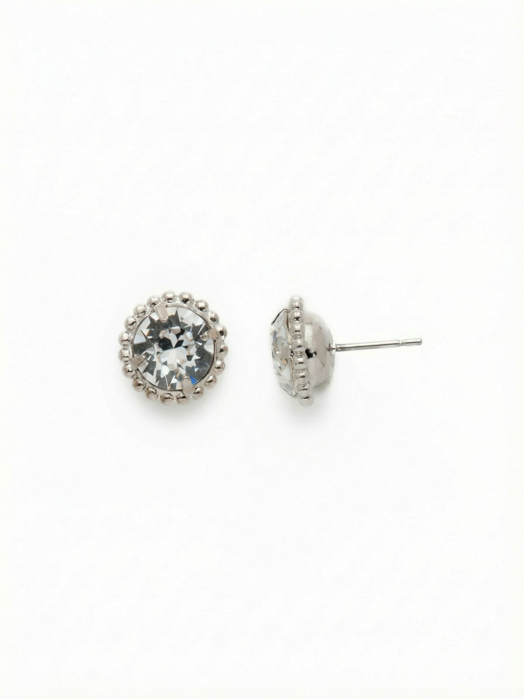 Simplicity Stud Earrings - EBY38PDCRY - <p>A single round clear crystal framed by a subtle ball chain border offers a refined take on the classic stud. They sit flush and balanced against the ear, casting a clean, quiet light that transitions effortlessly through your day. We paired these with our oversized comfort clutch back to keep the crystal anchored securely, ensuring they rest evenly and stay comfortable long after you put them on.</p><ul>
<li>Single clear crystal framed by a textured ball chain</li>
<li>Clean profile designed to sit flush against the ear</li>
<li>Post with oversized comfort-clutch back</li>
<li>Protective e-coat finish for lasting wear</li>
<li>Includes signature organza pouch for gifting and travel</li>
</ul>