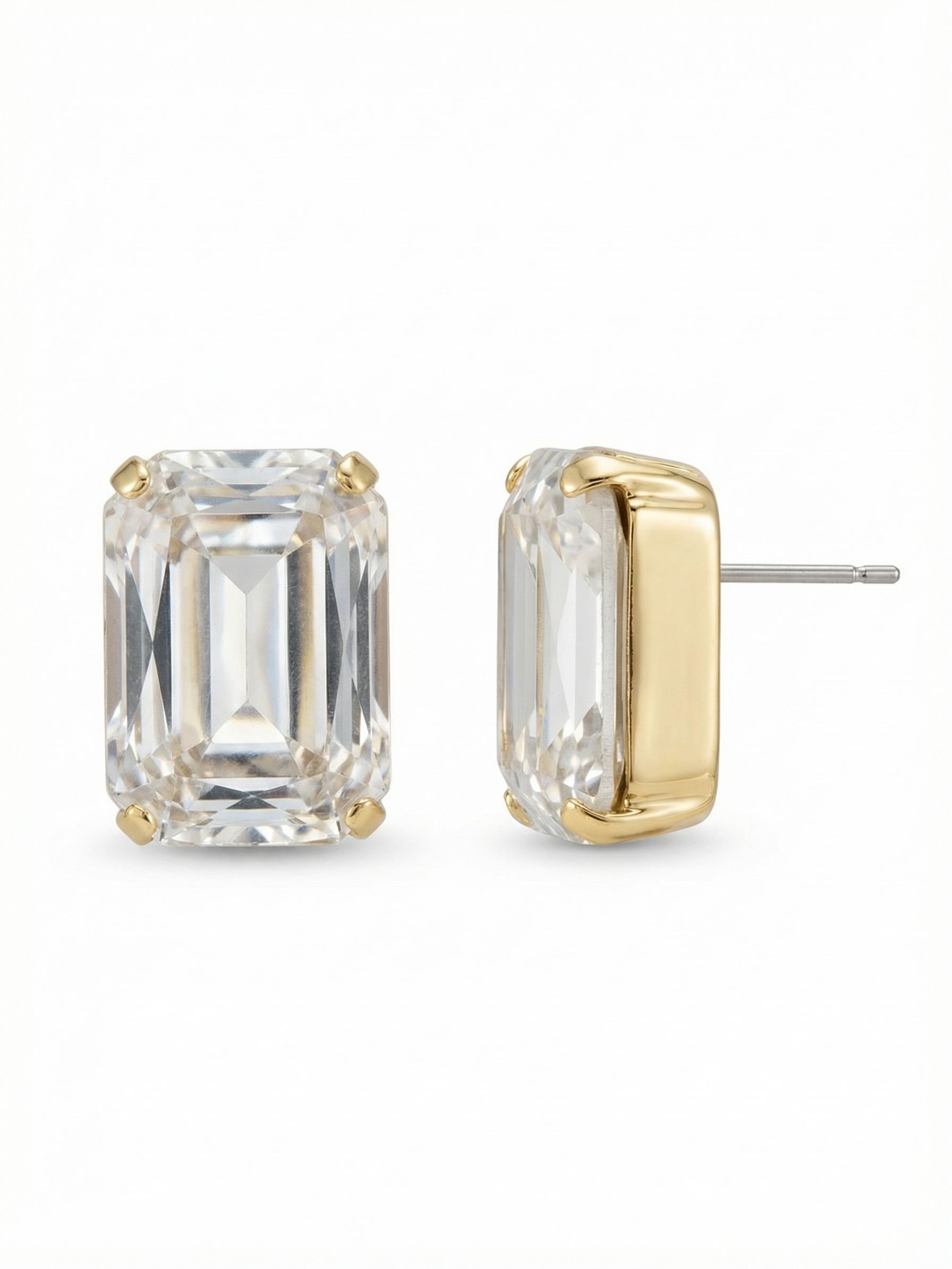 Brynn Stud Earrings - EBY44BGCRY - <p>These emerald-cut studs bring a quiet, architectural presence to your daily rotation. The clear crystal is shaped with deep linear facets, catching the light in broad, clean flashes rather than a scattered sparkle. Measuring three-quarters of an inch, they offer significant scale and clarity right at the face. The substantial setting gives them a polished, structured feel. To ensure these larger pieces wear effortlessly from morning to evening, an oversized comfort clutch holds the stone securely upright.</p><ul>
<li>Architectural step cuts create deep linear reflections</li>
<li>Thick polished sidewalls anchor the oversized scale</li>
<li>Post with oversized comfort-clutch back</li>
<li>Protective e-coat finish for lasting wear</li>
<li>Includes signature organza pouch for gifting and travel</li>
</ul>