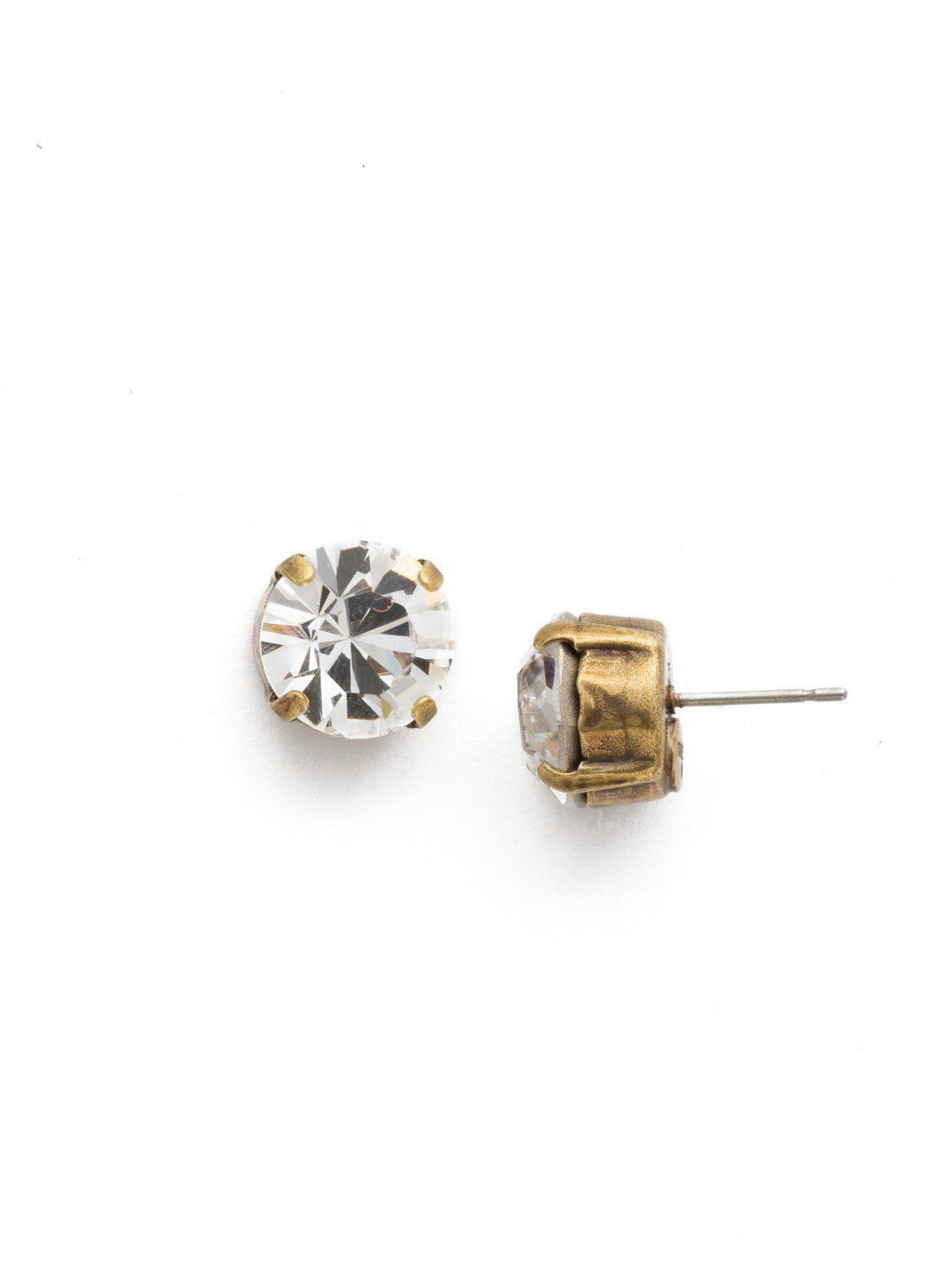 London Stud Earrings - ECM14AGCRY - <p>Everyone needs a great pair of studs. Add some classic sparkle to any occasion with these stud earrings. Need help picking a stud? <a href="https://www.sorrelli.com/blogs/sisterhood/round-stud-earrings-101-a-rundown-of-sizes-styles-and-sparkle">Check out our size guide!</a> From Sorrelli's Crystal collection in our Antique Gold-tone finish.</p>