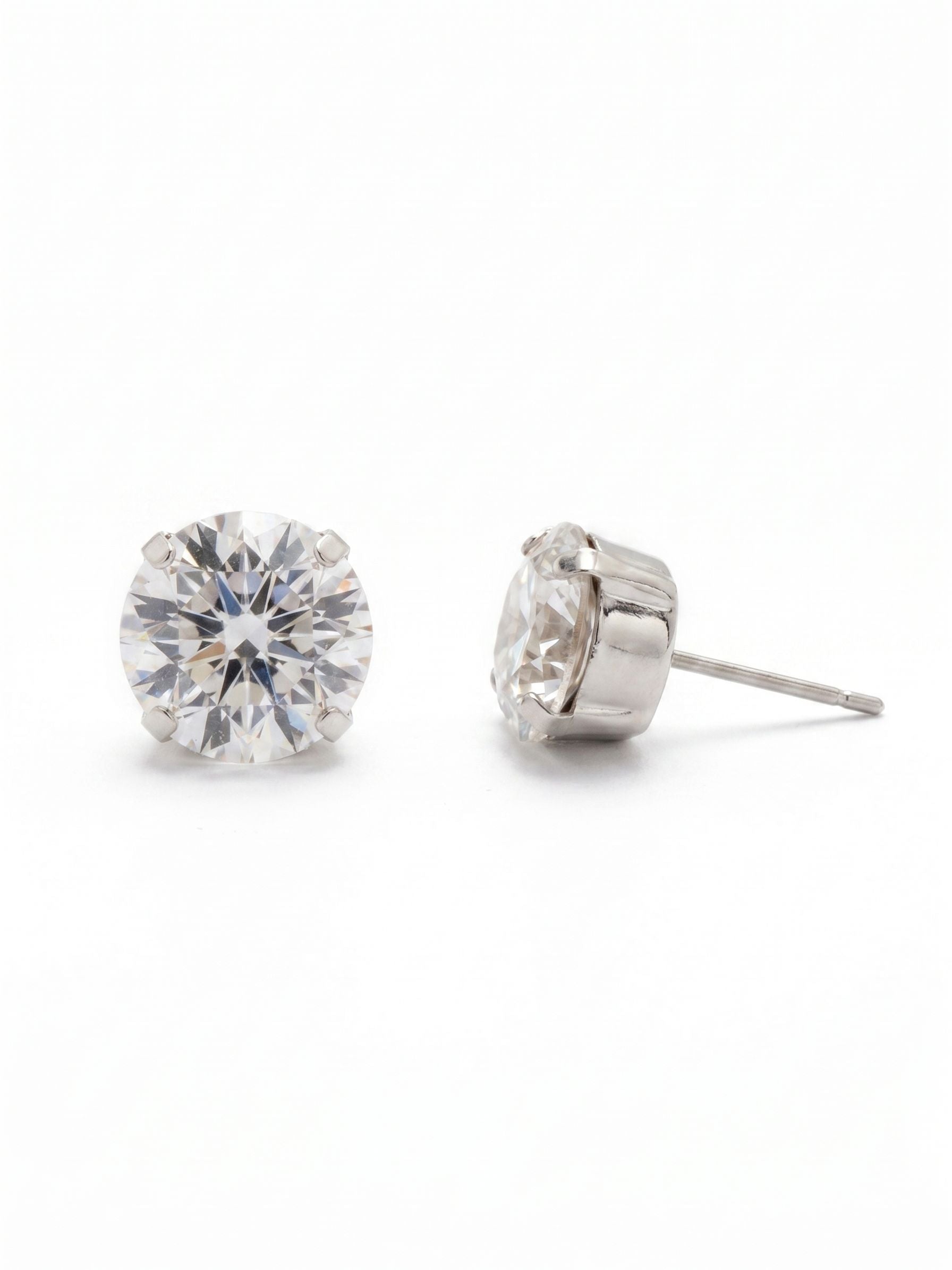 London Stud Earrings - ECM14PDCRY - <p>A definitive take on the classic solitaire. At half an inch wide, these round-cut clear crystals deliver substantial presence that registers clearly from across the room. Despite their generous scale, the stones sit securely and comfortably against the ear, held in perfect position all day by an oversized comfort clutch back.</p><ul>
<li>Substantial solitaire scale that reads clearly at a distance</li>
<li>Classic four-prong setting maximizes light through the clear crystal</li>
<li>Post with oversized comfort-clutch back</li>
<li>Protective e-coat finish for lasting wear</li>
<li>Includes signature organza pouch for gifting and travel</li>
</ul>