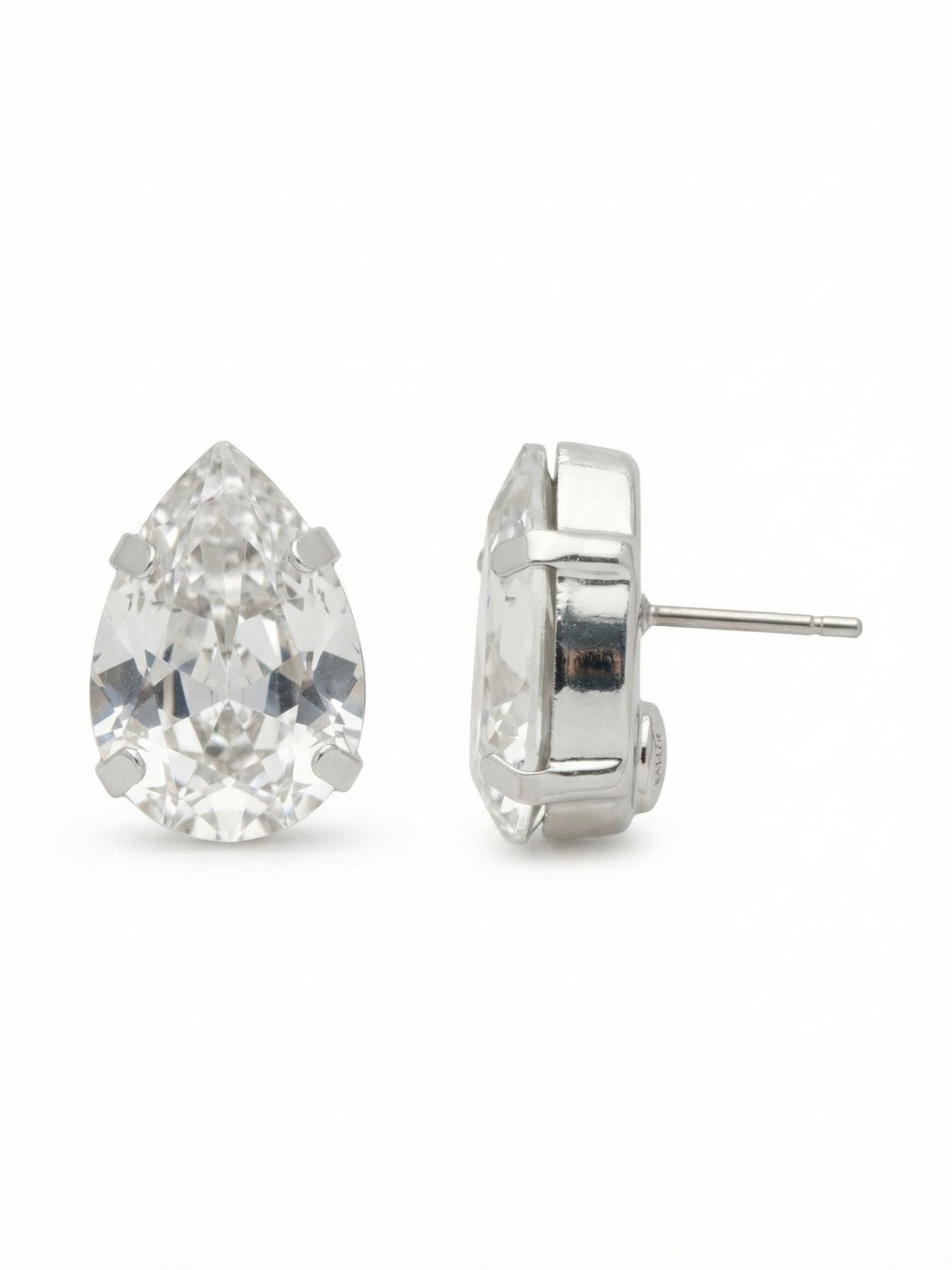 Ginnie Stud Earrings - ECR115PDCRY - <p>A single pear-cut crystal brings quiet impact to your daily rotation. At half an inch long, this stud strikes a deliberate balance, offering enough scale to catch the light from across a room while remaining anchored comfortably in place. The brilliant faceted face reflects everything around it in a clear, bright wash. An oversized comfort clutch back ensures the stone sits perfectly upright all day, giving you a polished finish that never feels heavy.</p><ul>
<li>Substantial pear-cut silhouette delivers noticeable brilliance</li>
<li>Minimalist prong setting maximizes the stone's light reflection</li>
<li>Post with oversized comfort-clutch back</li>
<li>Protective e-coat finish for lasting wear</li>
<li>Includes signature organza pouch for gifting and travel</li>
</ul>