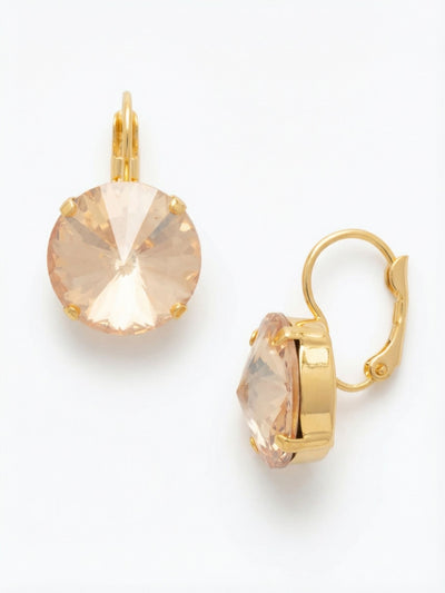 Nadine Dangle Earrings - EDH108BGGNS - <p>The oversized round crystal catches ambient light with a warm, golden glow. Dropping gently from the ear, this piece offers the confident scale of a large stud paired with the subtle mobility of a slight dangle. The secure closure keeps the weight beautifully balanced and comfortable throughout the day, ensuring the faceted stone always faces forward. It is a quiet, reliable design that brings an effortless polish to your daily routine.</p><ul>
<li>Oversized round crystal offers a clean and classic visual profile</li>
<li>Combines the immediate presence of a stud with the movement of a dangle</li>
<li>Hook drop for easy, lightweight wear</li>
<li>Protective e-coat finish for lasting wear</li>
<li>Includes signature organza pouch for gifting and travel</li>
</ul>