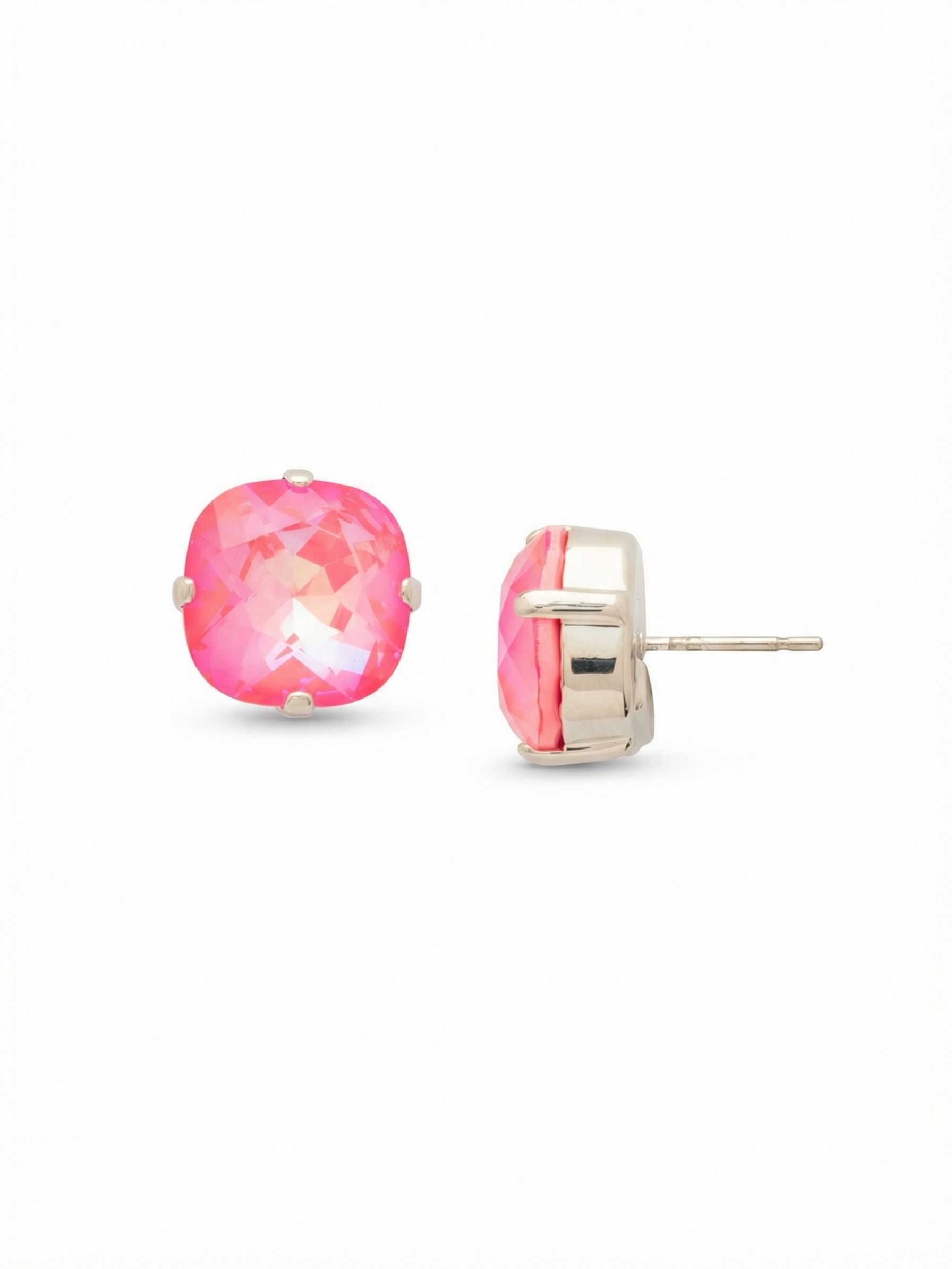 Aisha Stud Earrings - EDN16PDUC - <p>At half an inch across, these cushion-cut crystals deliver a substantial wash of color without feeling heavy. The vibrant pink stones shift gently in the light, bringing a bright warmth to the face. Because a larger stud requires proper balance, an oversized comfort clutch anchors the piece firmly in place from morning to night. It is a straightforward, confident design that relies entirely on the depth and clarity of a single crystal.</p><ul>
<li>Solitaire cushion-cut crystal profile</li>
<li>Iridescent stone creates a shifting spectrum of pink hues</li>
<li>Post with oversized comfort-clutch back</li>
<li>Protective e-coat finish for lasting wear</li>
<li>Includes signature organza pouch for gifting and travel</li>
</ul>